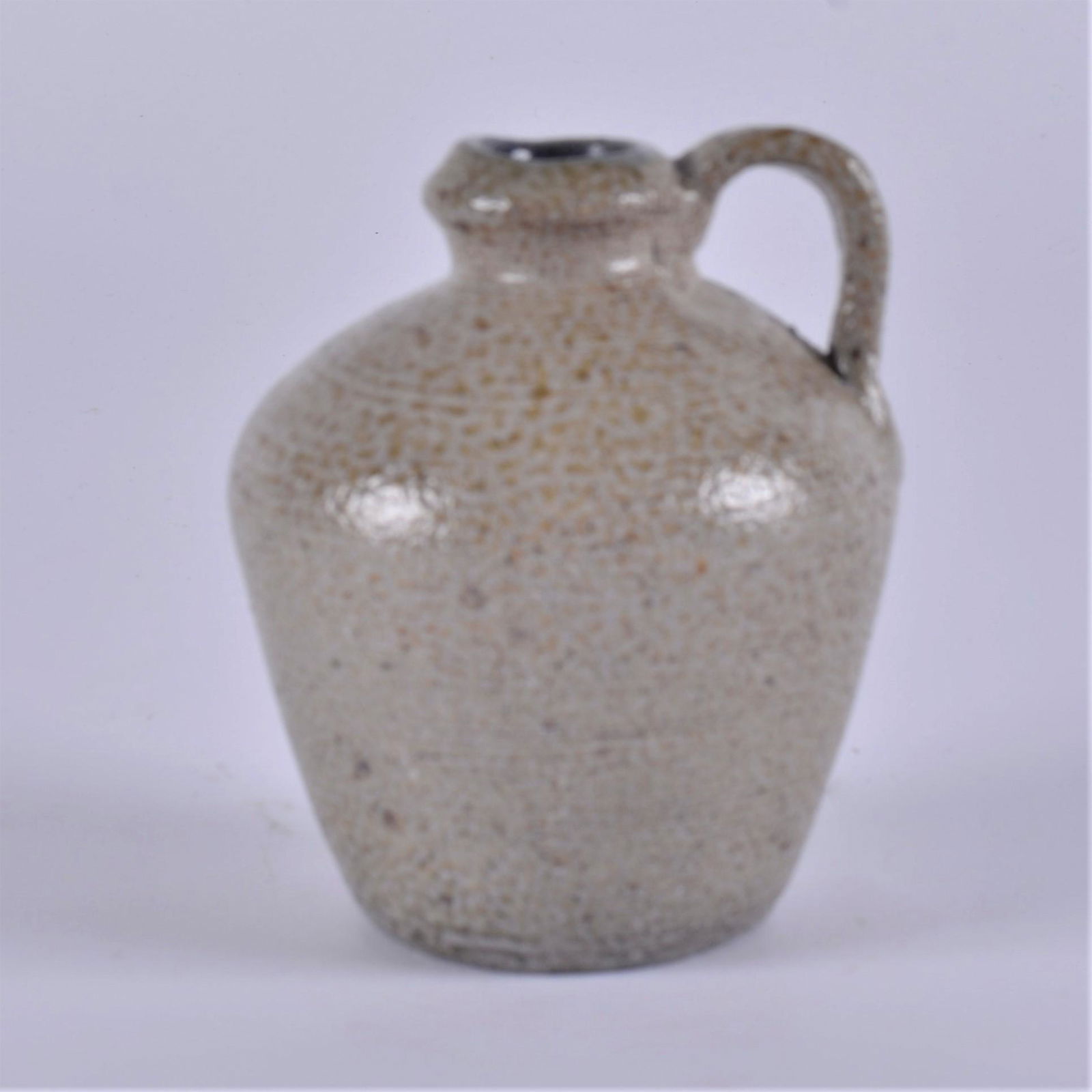 Charles Moore Salt Glaze Jug: rare uitlitarian pottery salt glaze jug. With the smallest hint of cobalt blue at the neck lip. Signed first kiln on bottom. Dated 1998. Height 4.5"
