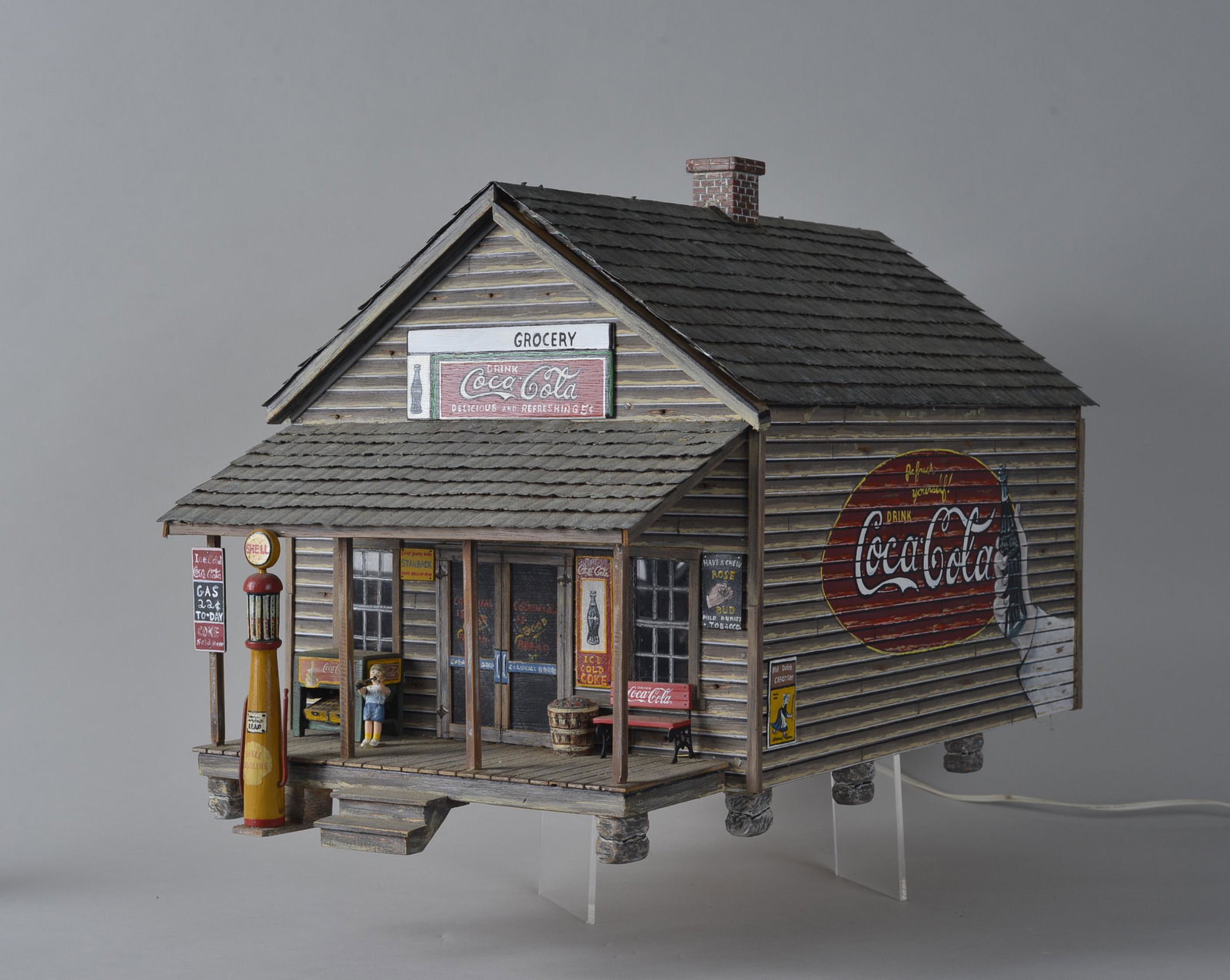 Jeramy Williams Folk Art Wooden Gas Station: Jeramy Williams from Godwin, NC. very meticulously made lots of detail. Hand made, lite up, with figures inside.. HEIGHT 14", LENGTH 25", WIDTH 12.75"