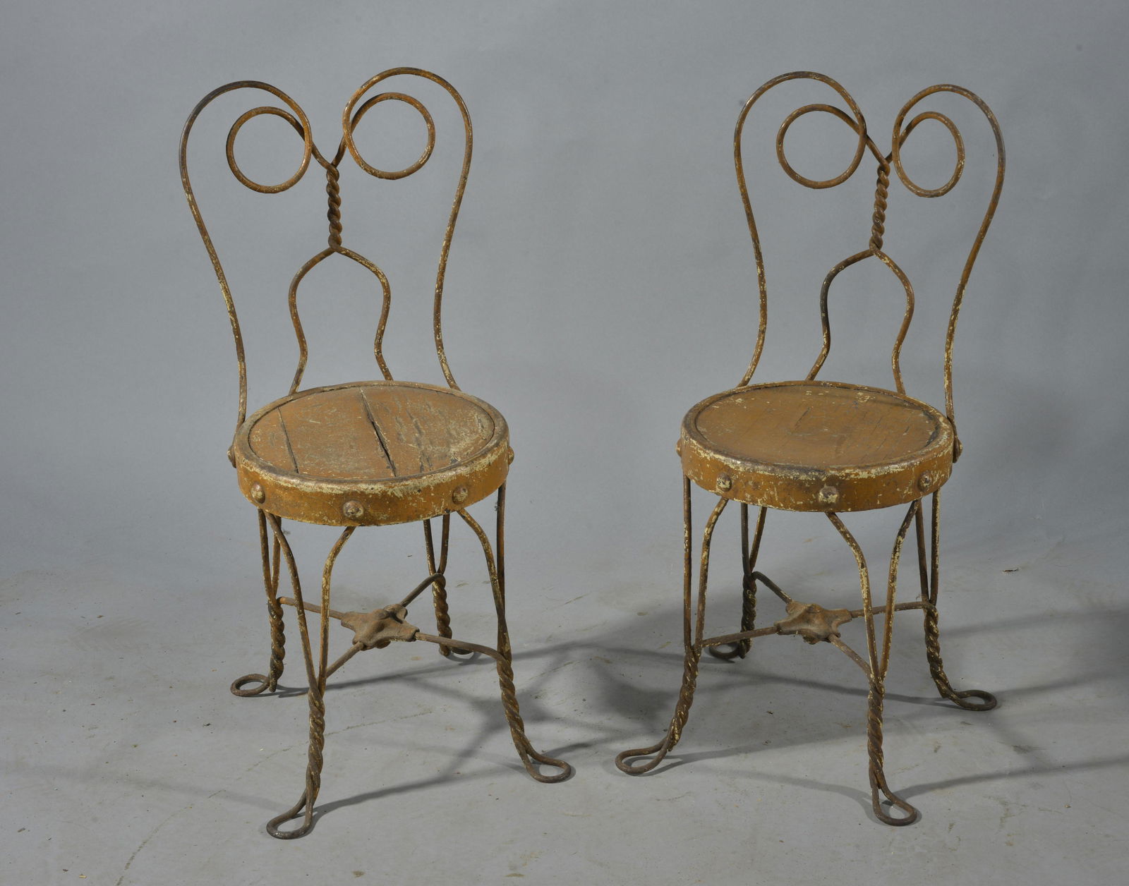 Antique Child's Ice Cream chairs: ca. 1900 iron and wood. 24"H x 10"W