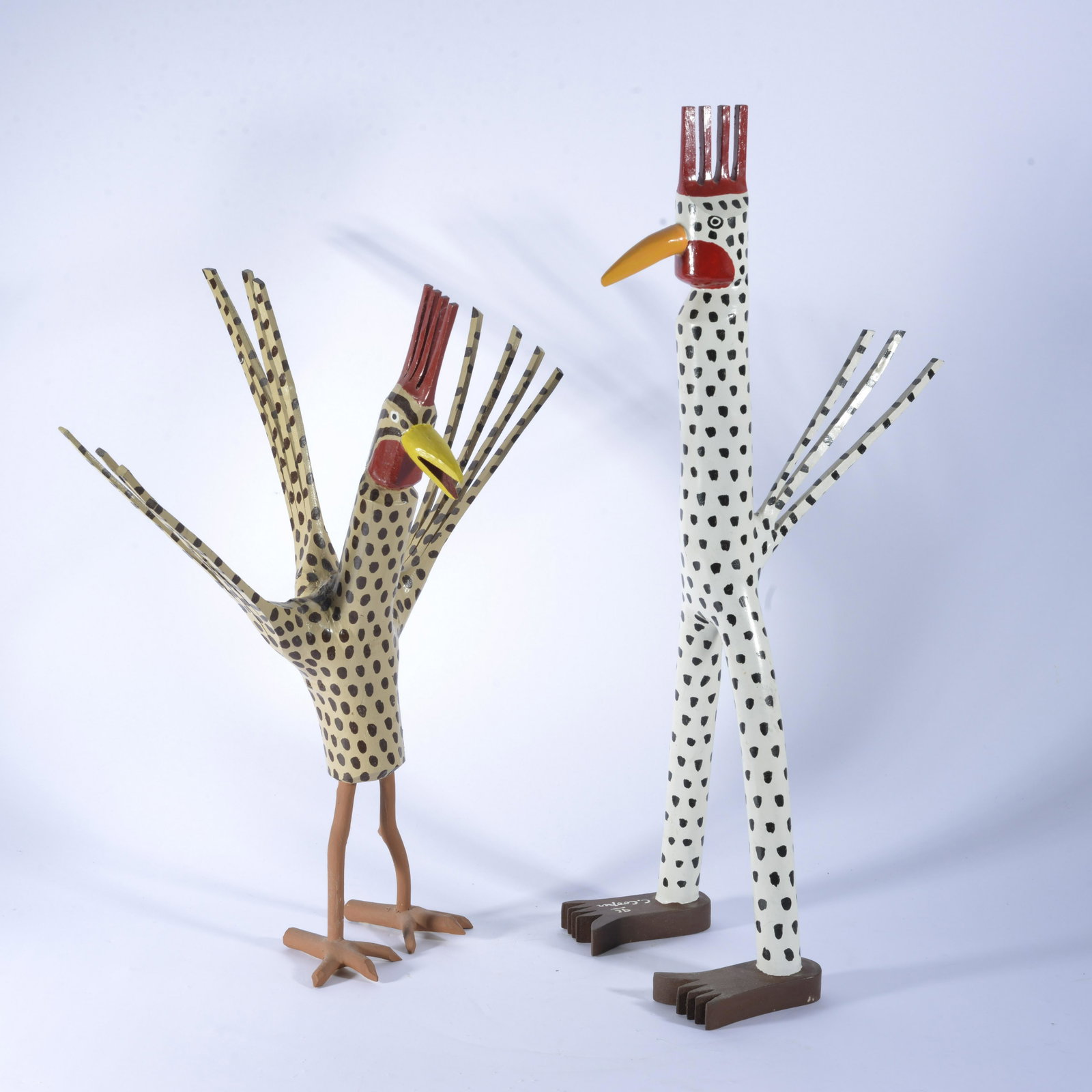 Chris Cooper Folk Art: wood and paint. Signed on foot. 22"H x 7.5" across at feet of the tallest rooster
