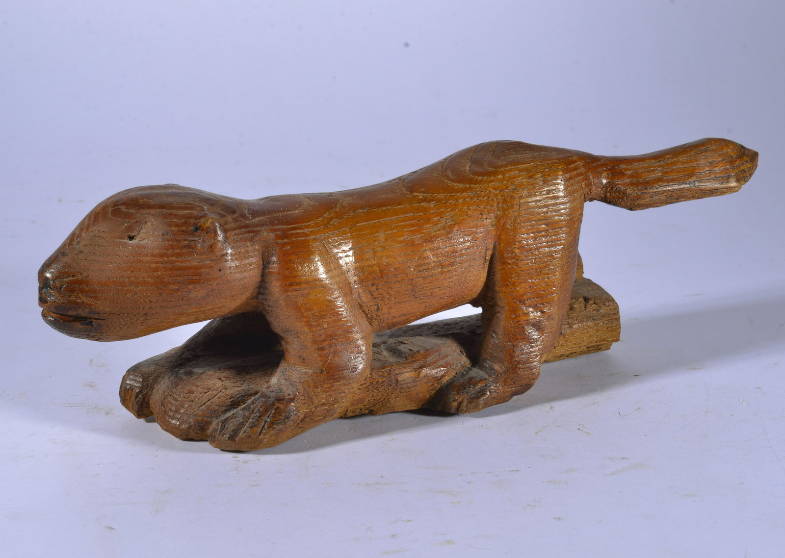 CHARLES SIMMONS CARVED SQUIRREL: folk art carved squirrel by Charles Simmons signed and dated 1991. 12"x4"