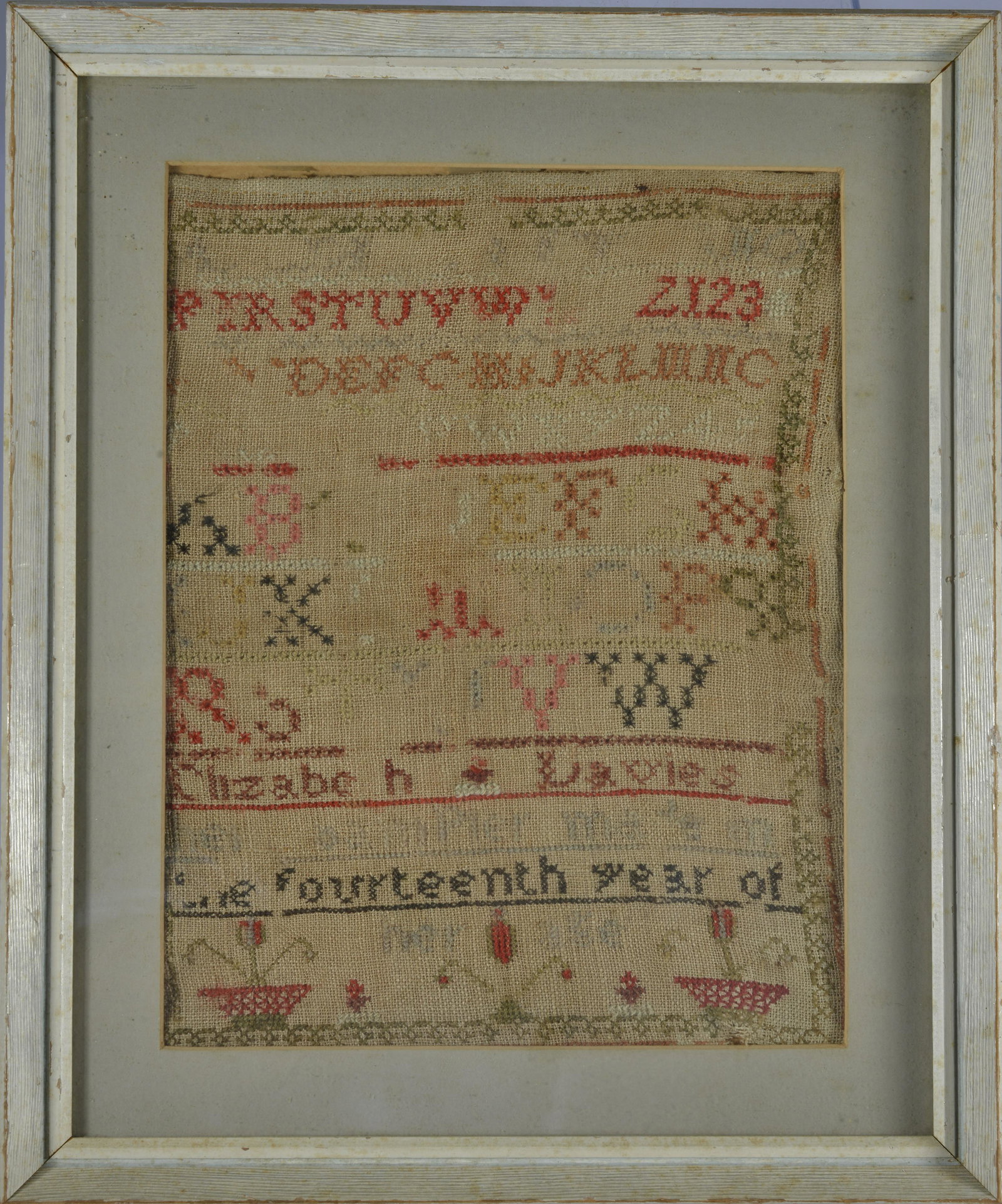 NEEDLE WORK SAMPLER: MID 19TH CENTURY NEEDLE WORK. FRAMED. 13"x16"