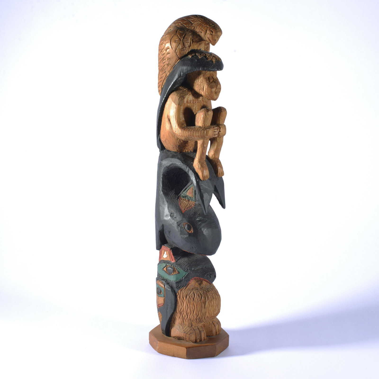 Northwest carved totem pole: paper labels on bottom, Alaska Totem Trading, signed on bottom. 16.5" tall