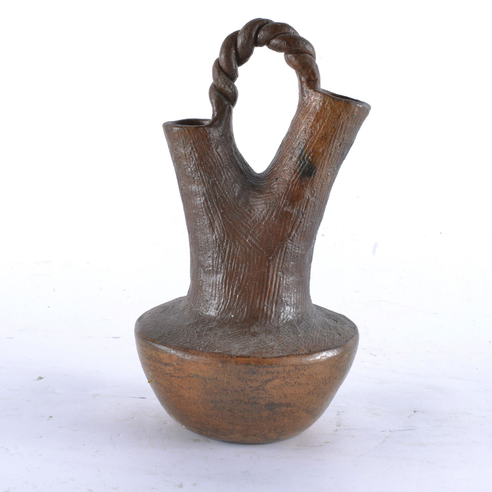 NAVAJO POTTERY WEDDING VASE BY J MANN: Based upon a couple examples found online, there is a Navajo potter that carves their low temperature fired pots named J. Mann. The signature on the base of this has the same last name w/ similar lett