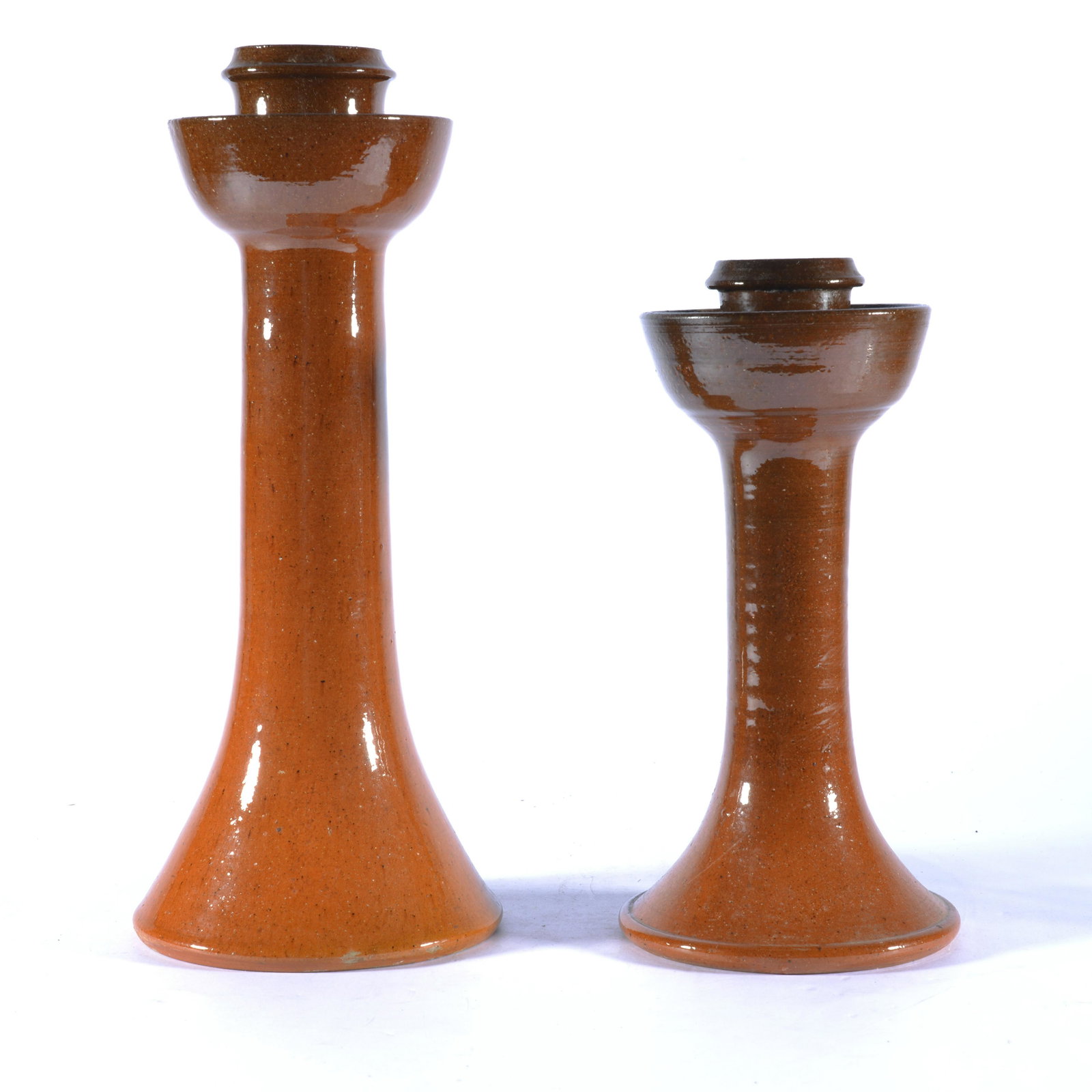 BEN OWEN MASTER POTTER PAIR OF CANDLESTICKS SEAGROVE NC 1960s: Signed w/ Ben Owen Master Potter circular stamp on base. Slighter dark hue (possibly simply due to the firing) from Lot #145. Tallest is 12.25" tall.