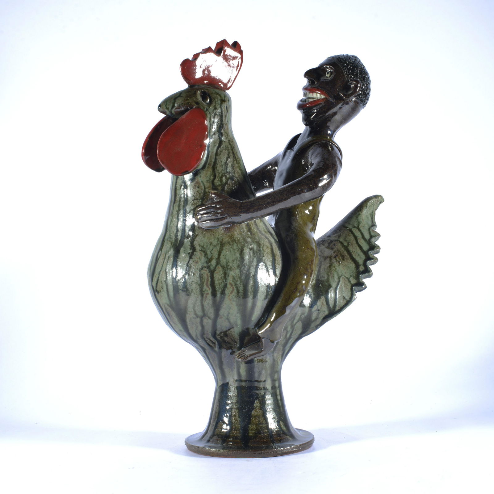 MARVIN BAILEY POTTERY EARLIER ROOSTER W/ RIDING MAN CIRCA 2010: black man riding chicken signed on bottom ca. 2010. 16.25" tall X 10".