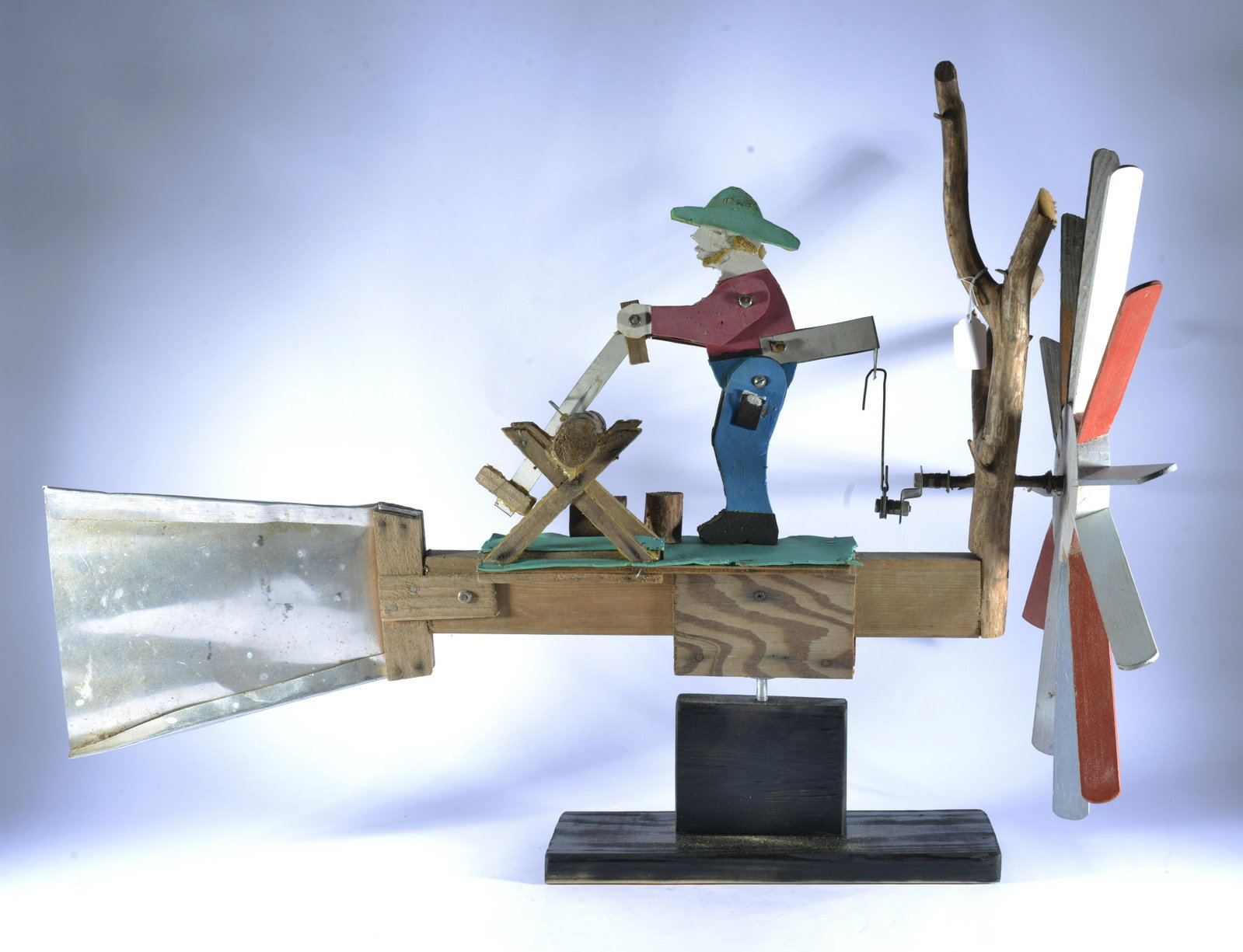 American Folk Art Whirligig: wood and paint, comes with base. Ca. 1950. 34" long by 24" tall.