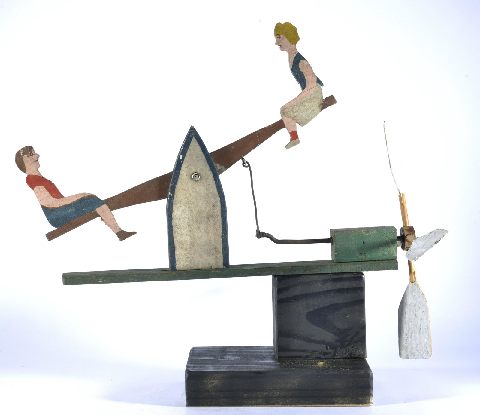 American Folk Art Whirligig: wood and paint, comes with base. Ca. 1953. 15" long by 13" tall.