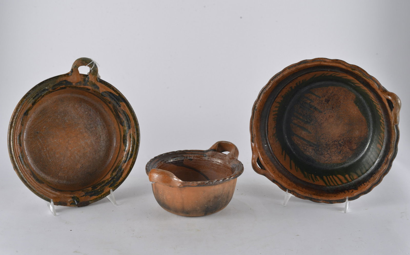 FANTASTIC MEXICAN ELABORATE SET (3) OF COOK WARE CIRCA 1900: Wonderful set of cookware. Elaborate twisted handles & scalloped edges of pots help make this beautiful redware even more eye-appealing. Likely from Mexico & circa 1900. Definitely well-loved. Smalles