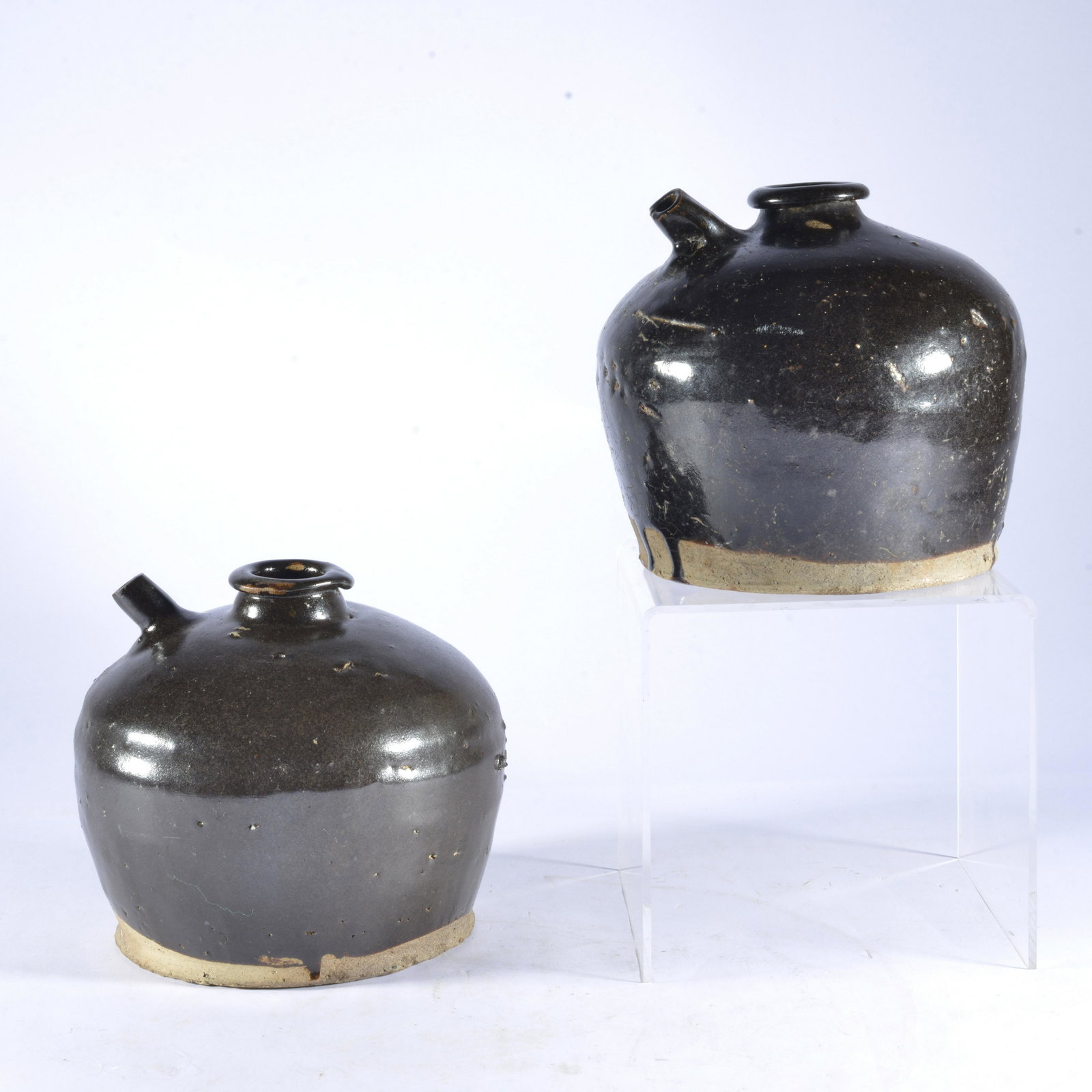 Asian soy sauce bottles: pottery, from Asia. Both are 5" tall.