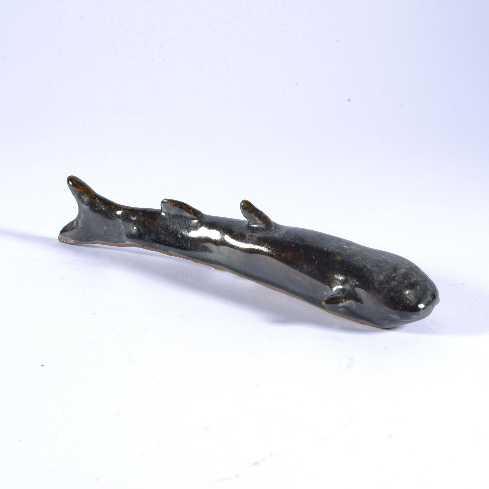 Charles Moore Gunmetal Glaze Catfish Figural Jugtown Folk Pottery: Charles Moore, along with Boyce Yow, would fill the gaps in the Jugtown shop with these delicious catfish. Boyce's are distinctly unique and much more perfectly perfectly symmetrical. This was created