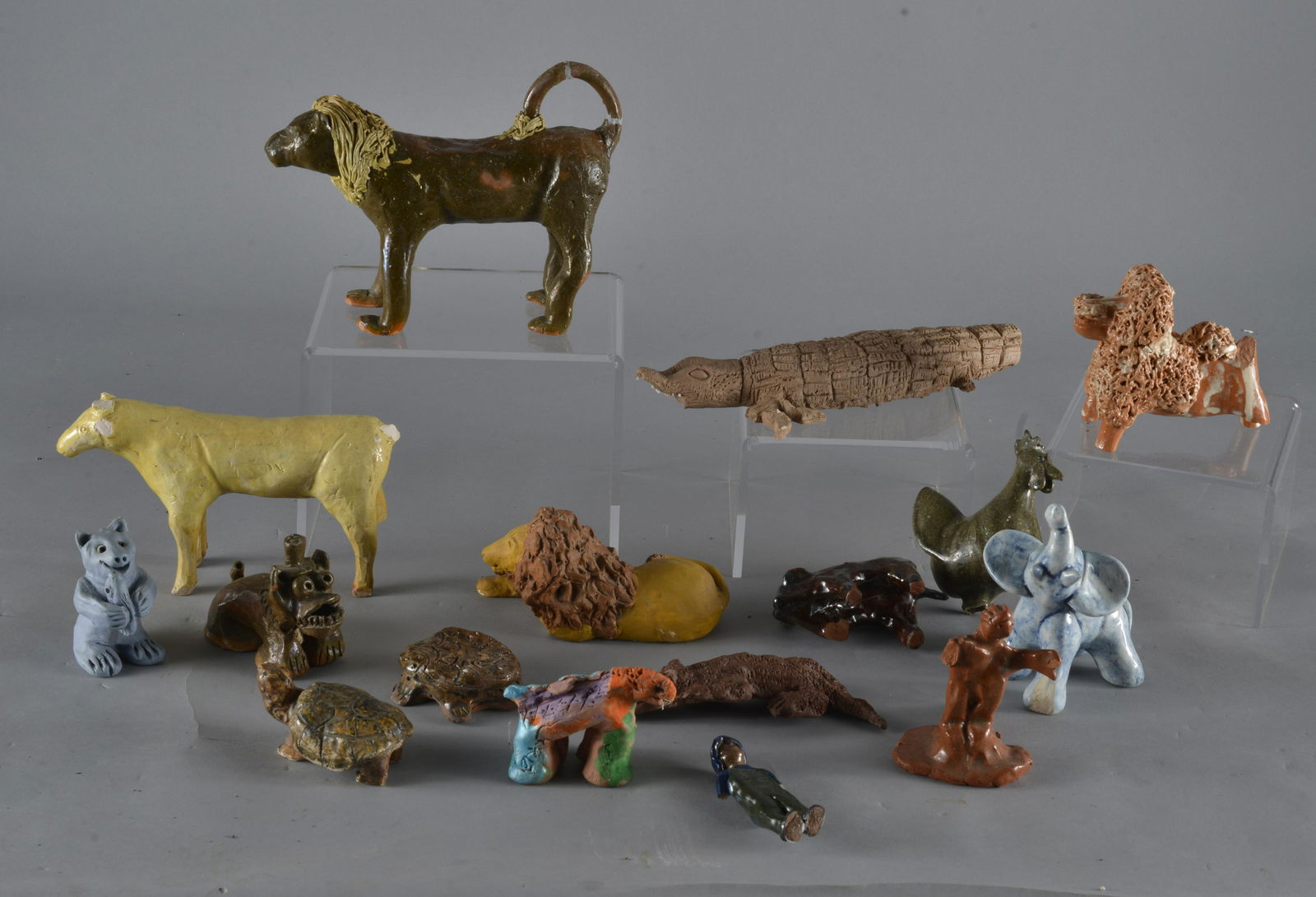 Southern Pottery Grouping with DAMAGE Charles Moore Ellen Martin et al: most items have damage, some are complete, see photos, all sales are final on all lots in this auction- overall smaller pieces, the Charles Moore lion is 9" in length. There is also a 2002 Ellen Marti