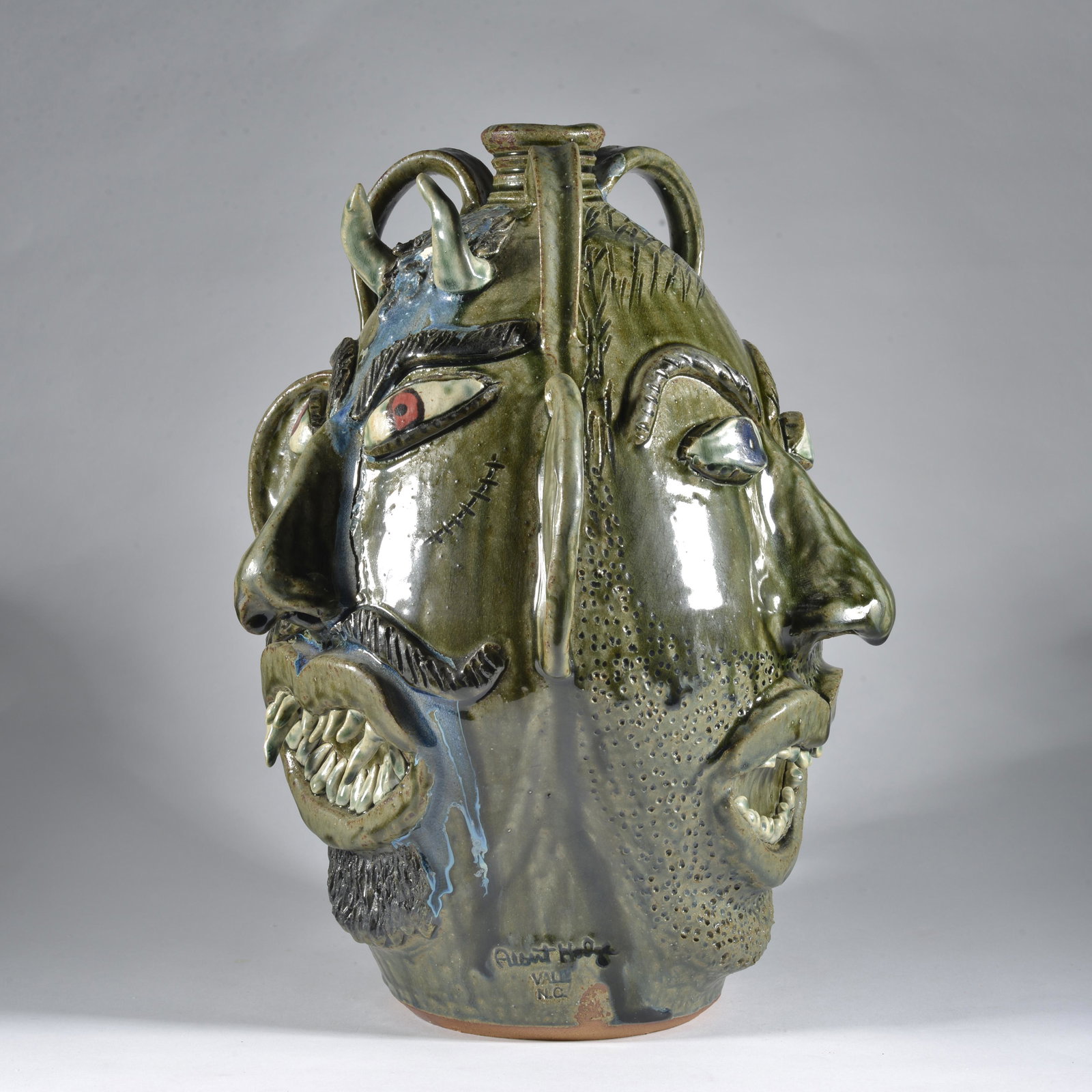 Albert Hodge Monumental Classic Triple Face Jug Pottery Catawba Valley NC: Albert Hodge, now retired, created folk pots of in the middle of the Catawba Valley on NC 10 in Vale, NC, just down the street from Kim Ellington & Charlie Lisk. Initially for the first few years he w