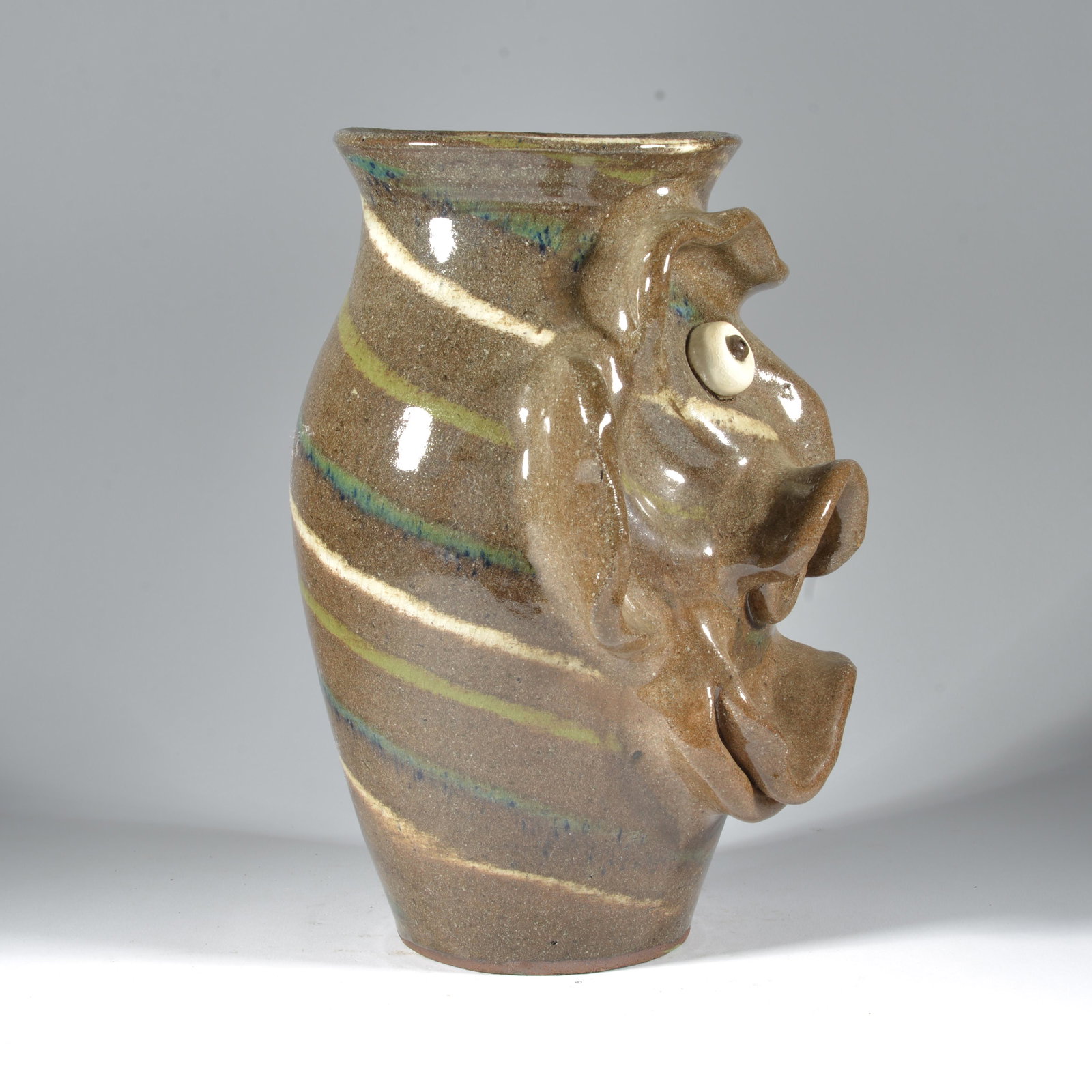 Joe Reinhardt Joint Swirl Face Vase with Ronald Bryant Jordan NC Pottery: A number of pots in the auction are either joint pieces between Joe Reinhardt and his good friend Ronald Jordan. He would occasionally put some funky faces on Joe's pots, sometimes do incised decorati