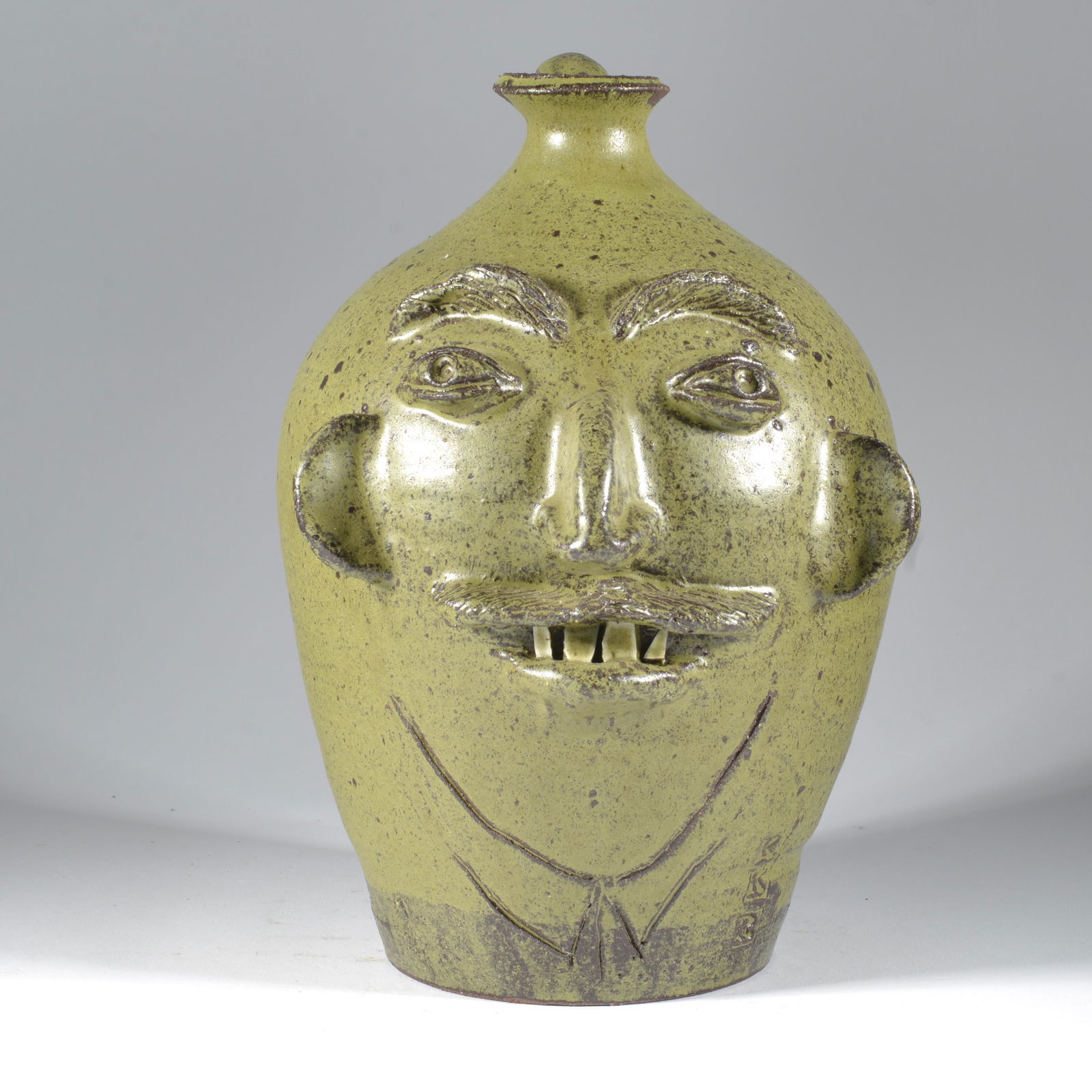 Ben Allman turned Kathy Kennedy Richards Face Joint Face Jug NC Folk Pottery: When first reviewing this pot, the face didn't quite appear like Ben and that is because fellow Catawba Valley potter, Kathy Kennedy Rickhards, applied it. Her KKR vertical stamp mark is toward the ba