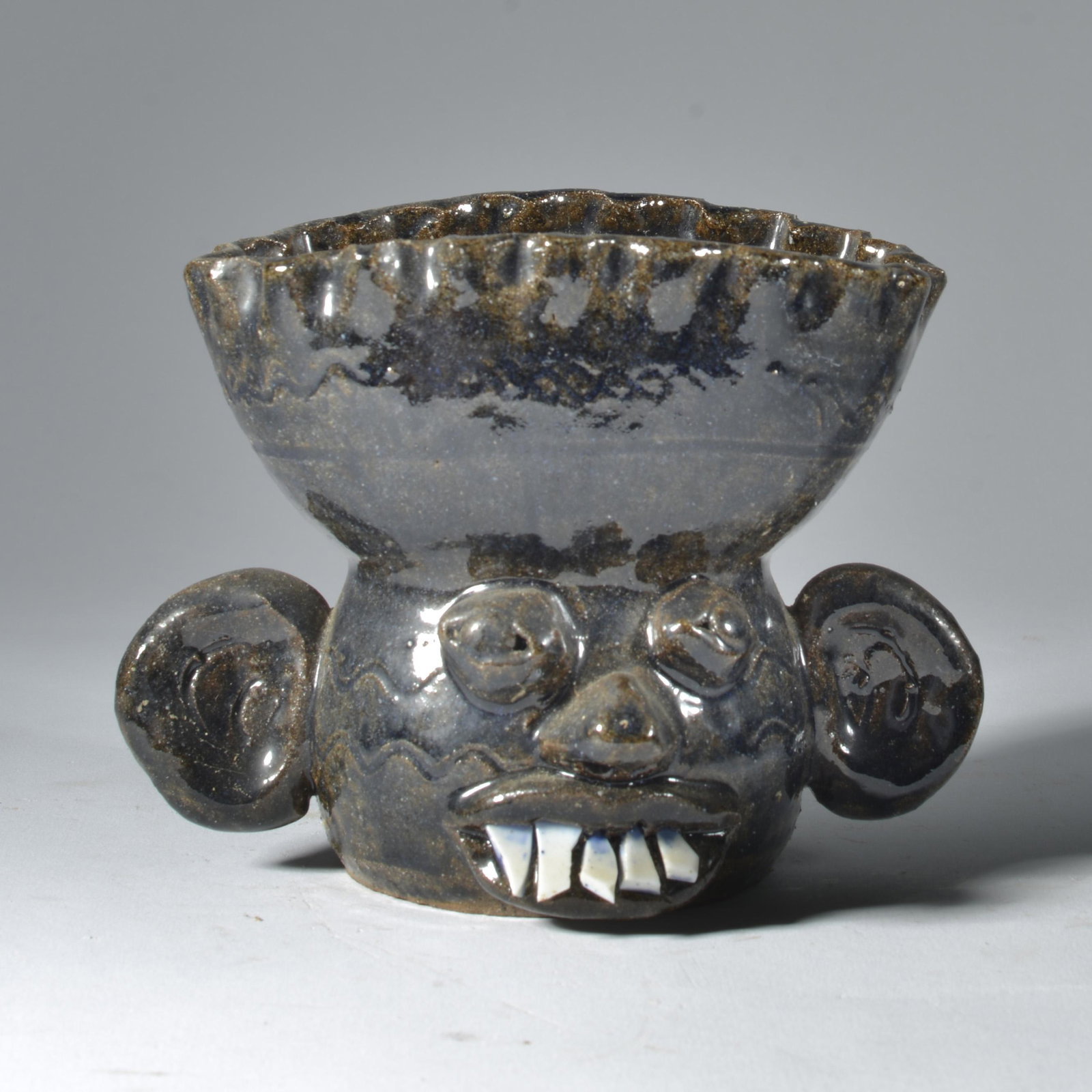 Kathy Richards Face Jug Goblet Pottery Catawba Valley NC: Kathy is most famous for her signature 'vinegar hag' pots that are bottle figurals. She creates a separate stopper for the bottle. And she has some serious aficionados for that form. She also creates 