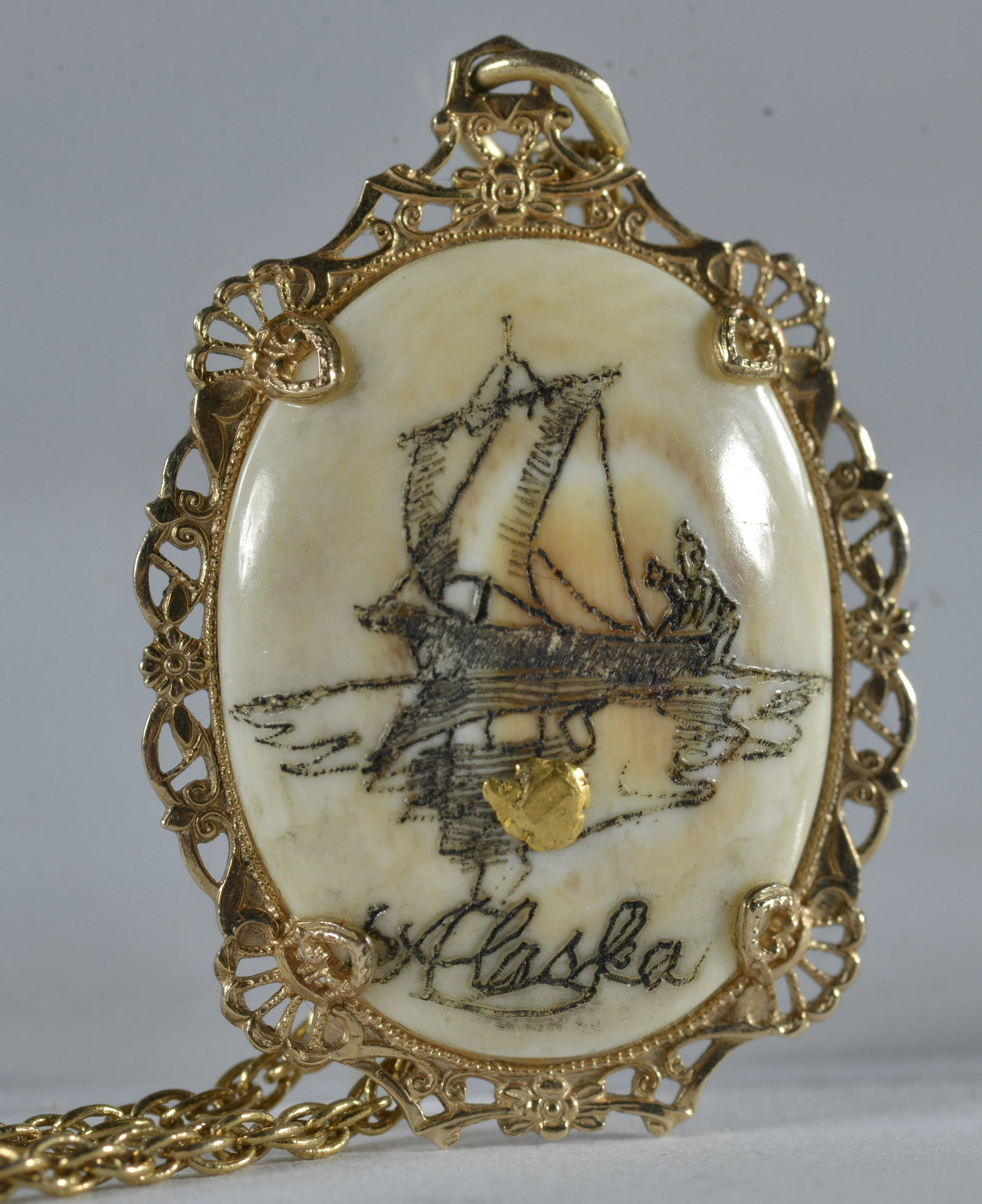 Alaska Carved Pendant with Gold Nugget: from alaska, a fantastic estate item. Pendant is 1.5"
