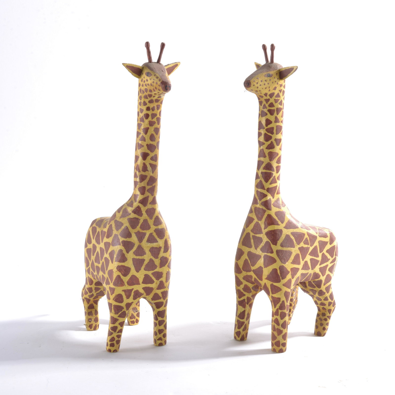 Kenneth Lee Myers Carved Giraffe Pair: carved and painted wood. Signed on bottom. 9"