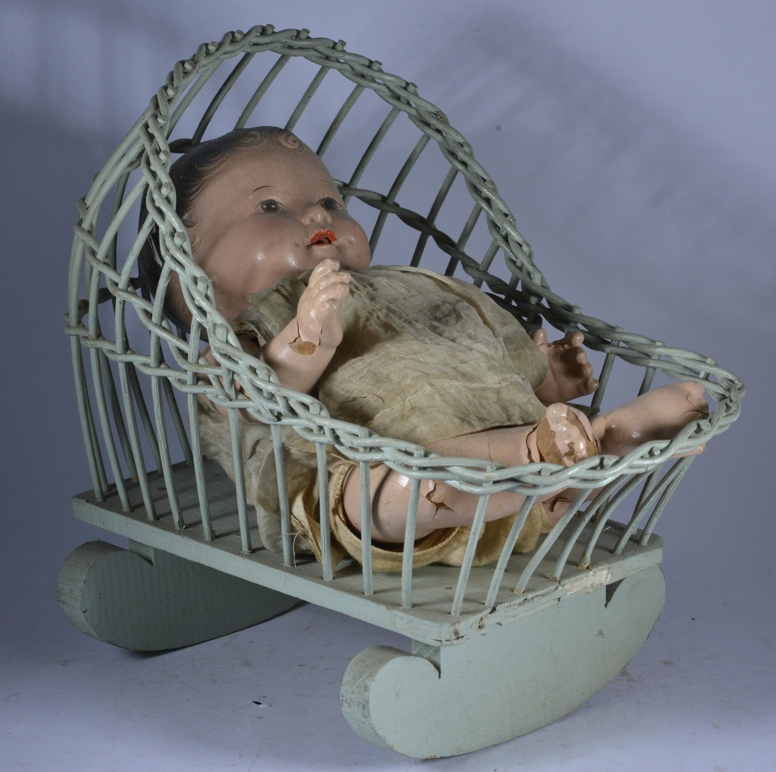 Baby Doll and Cradle: ca. 1950 items have ware. baby doll in bad shape.