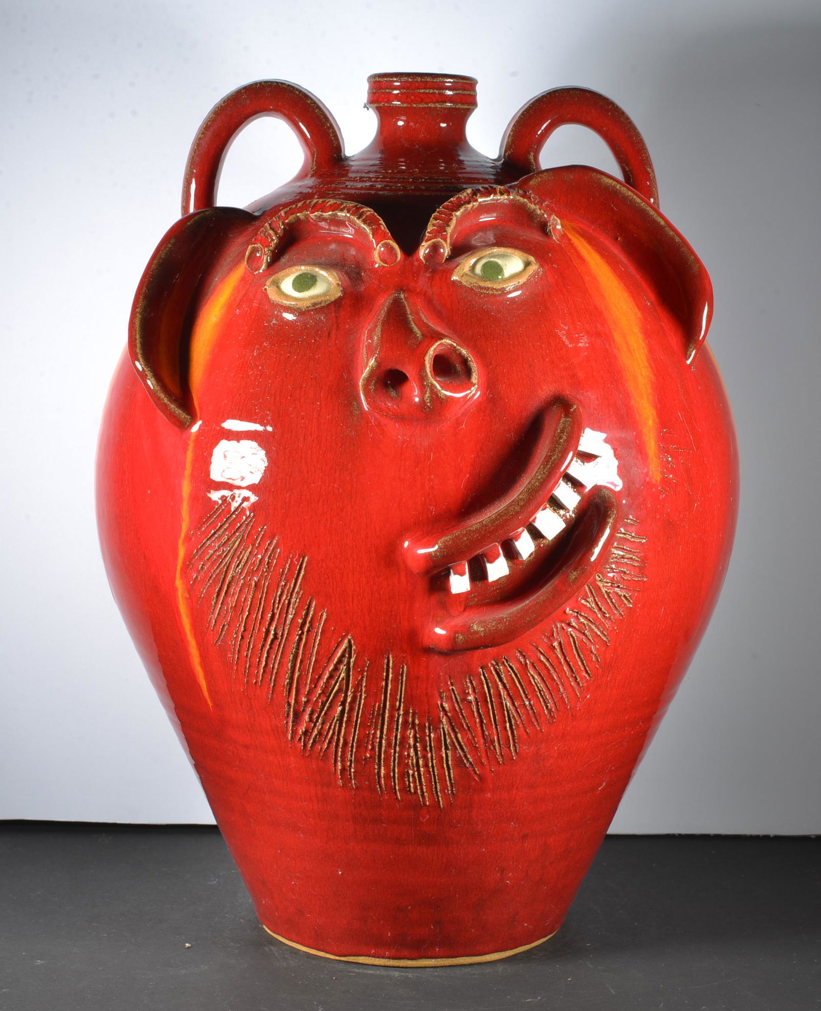 AV SMITH RED GLAZE FACE JUG: VERY RARE RED GLAZE GLASS RUNS CHINA TEETH LARGE FACE JUG SIGNED ON BOTTOM 15.5" TALL
