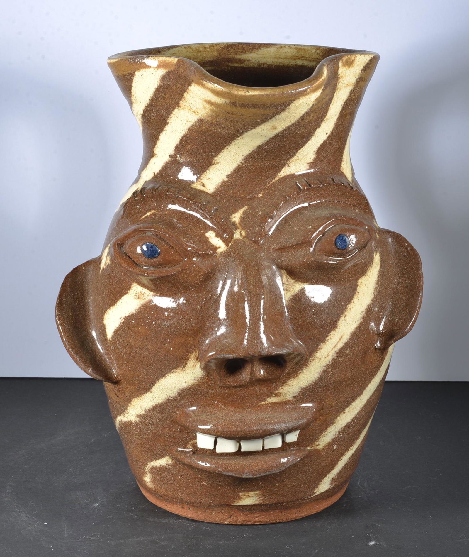 WALTER FLEMING SWIRL FACE PITCHER: STAMP ON BOTTOM CHINA TEETH 8.25" TALL