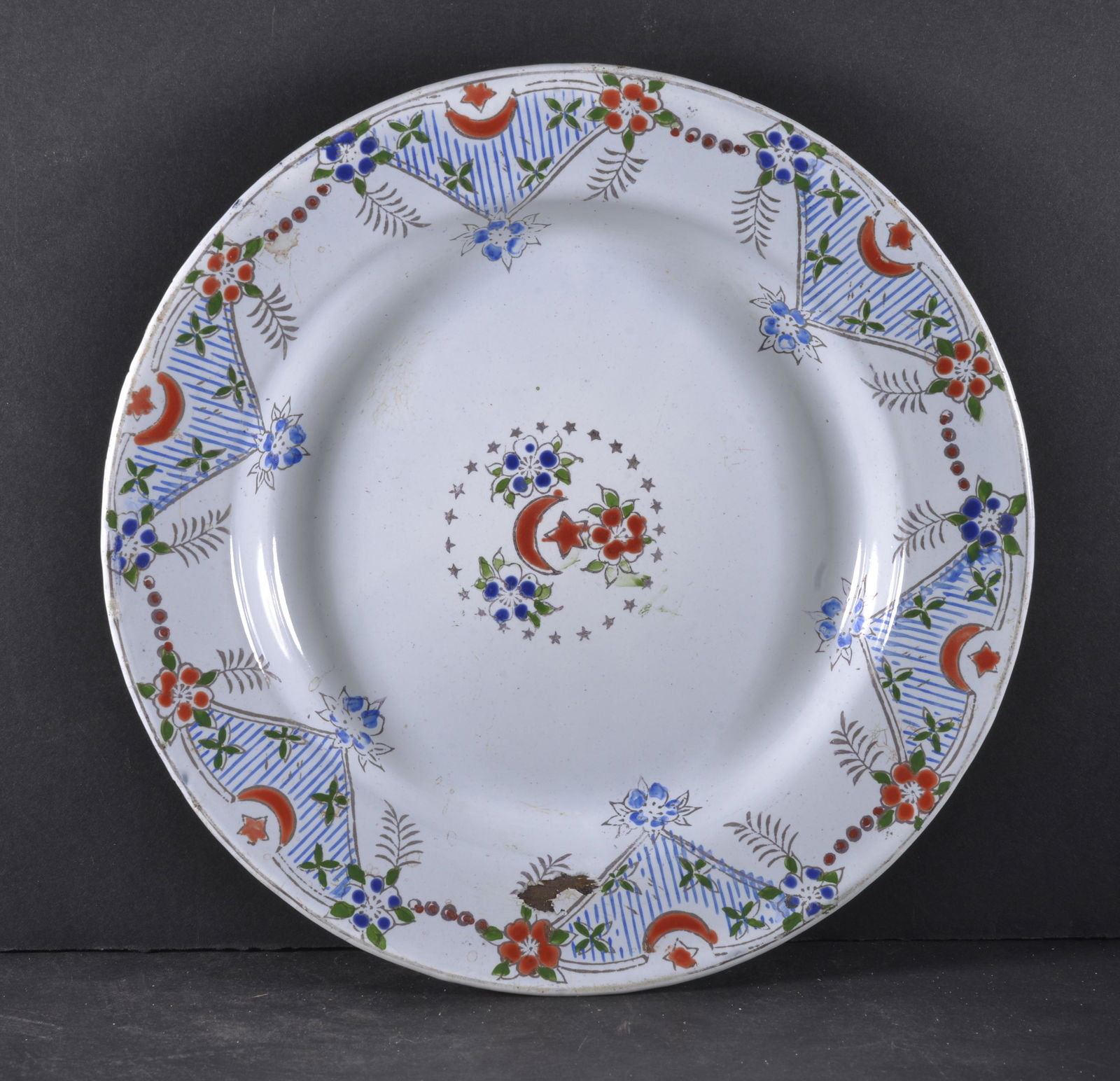 EUROPEAN ENAMELWARE DEEP PLATE: EUROPEAN ENAMELWARE DEEP PLATE DEPICTING MOON, STARS, GRAPES AND FLOWERS 9" DIA