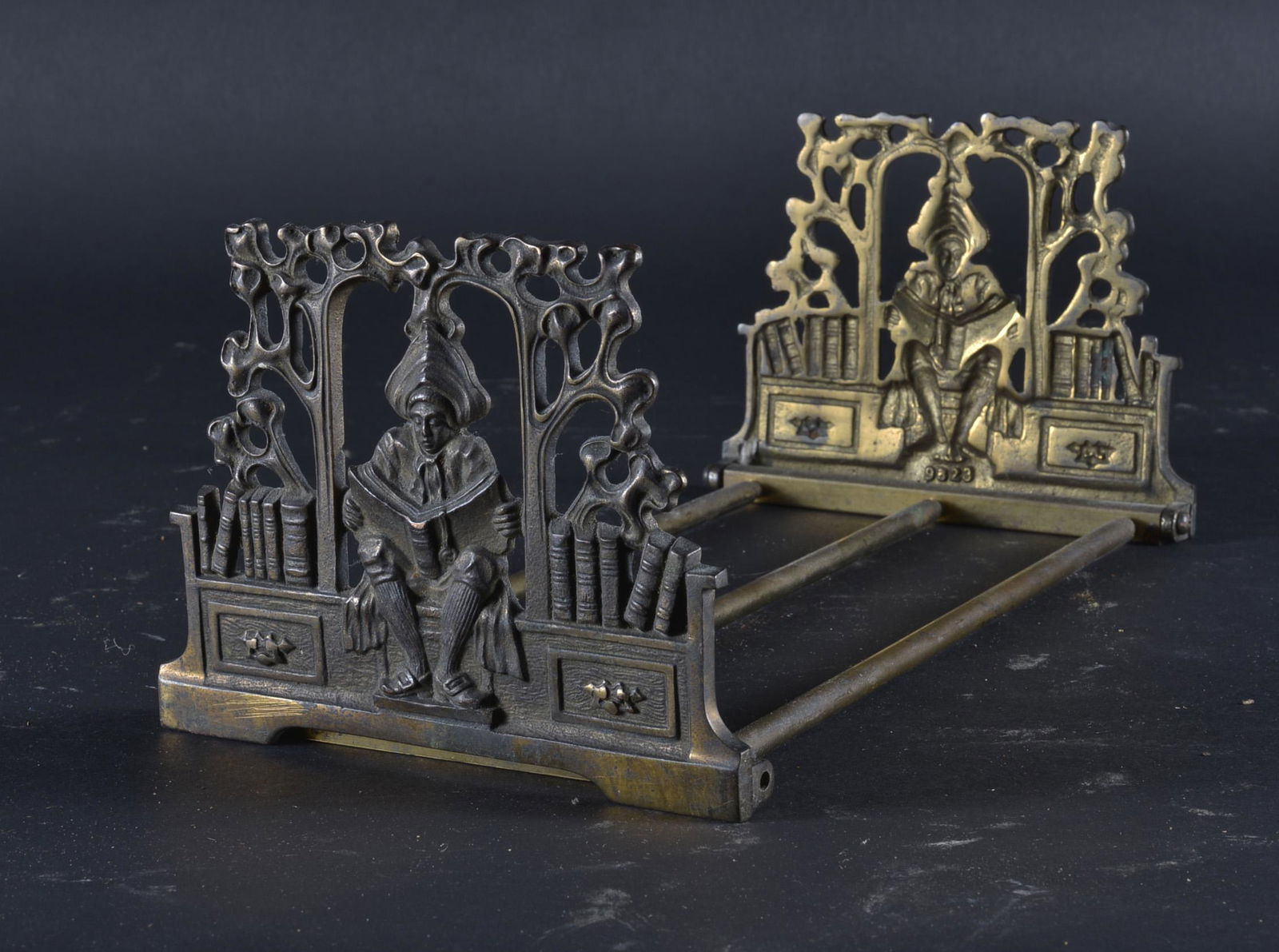 ART NOUVEAU FIGURAL BOOKENDS: ART NOUVEAU FIGURAL ADJUSTABLE BOOKENDS DEPICTING A MAN READING ON THE END OF PANELS 12.5" H