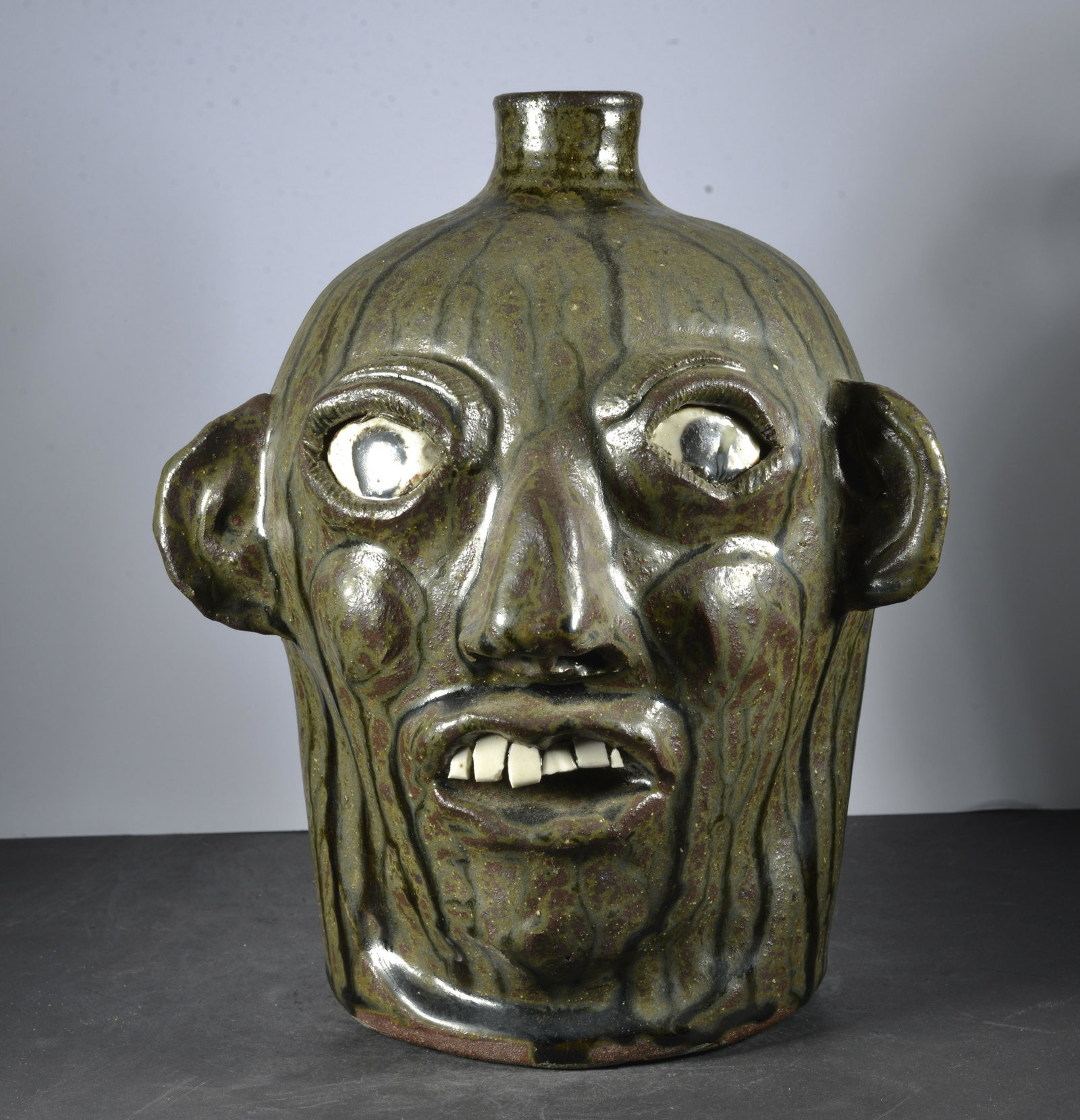 GRACE NELL HEWELL FOLK ART POTTERY FACE JUG: GRACE NELL HEWELL FOLK ART POTTERY FACE JUG CHINA PLATE TEETH SIGNED ON DATED ON BOTTOM 1993 9" TALL