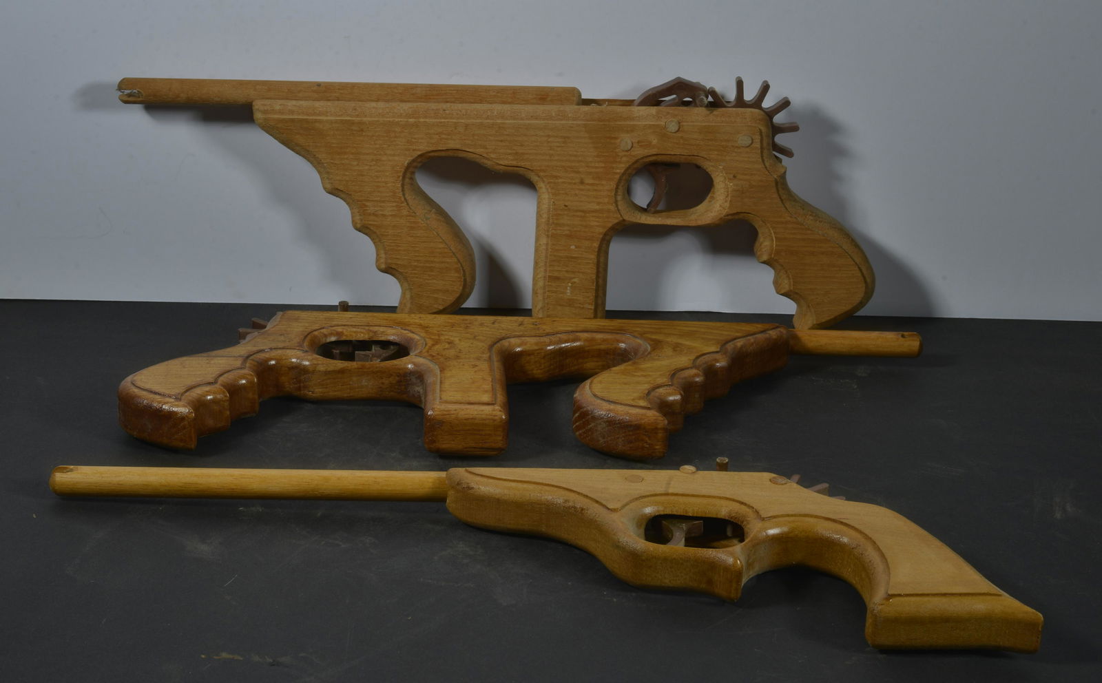 COLLECTION OF (3) FOLK ART WOODEN RUBBER BAND GUNS (1 of 2)