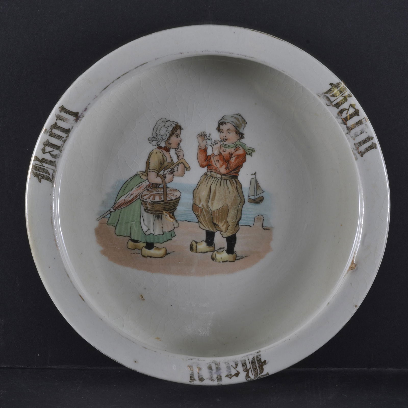 VINTAGE BABY PLATE: VINTAGE BABY PLATE DEPICTING YOUN BOY SMOKING A PIPE 7 " DIA