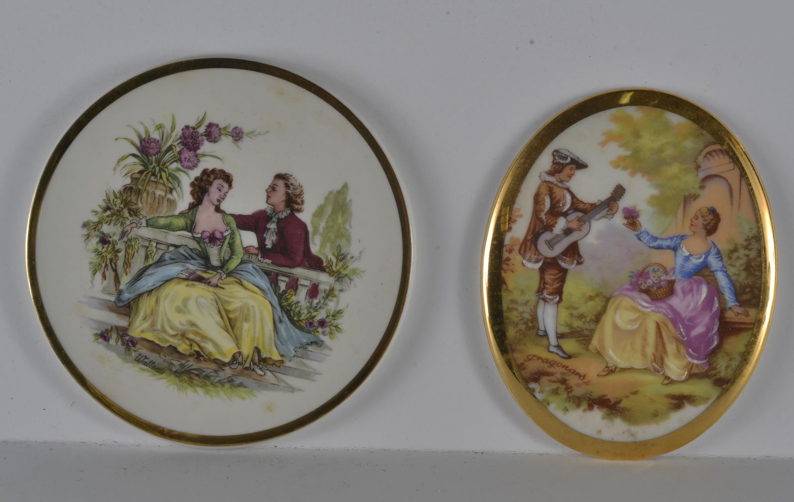 COLLECTION OF (2) SIGNED LIMOGE MEDALLIONS: COLLECTION OF (2) SIGNED LIMOGE MEDALLIONS (1) ROUND SIGNED GERMAY 102 ON BACK (1) OVAL SIGNED DUCHAMP ON BACK 4.5"L