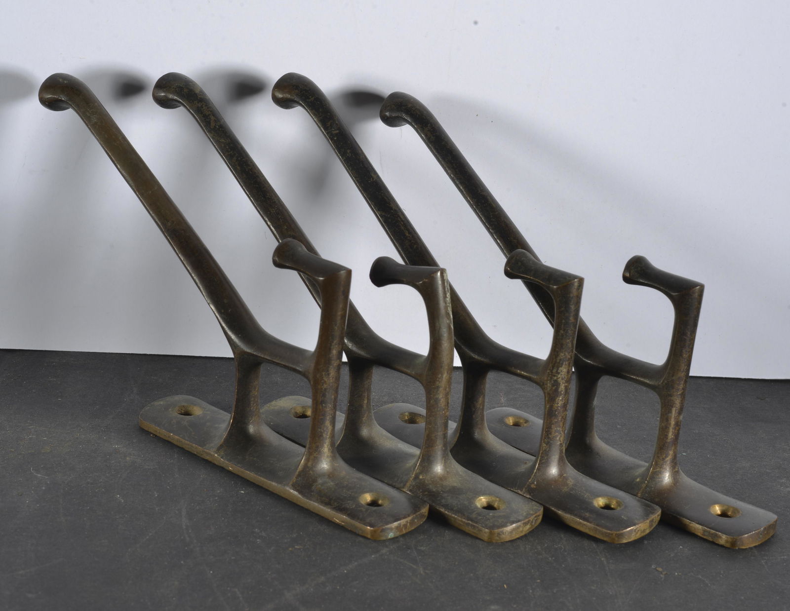 COLLECTION OF (4) MATCHING  RAILROAD ROAD COAT HOOKS (1 of 2)