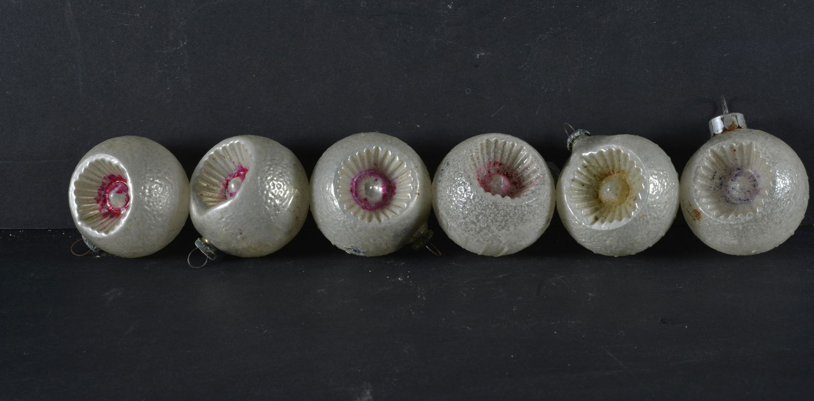 COLLECTION OF (6) CHRISTMAS ORNAMENTS: COLLECTION OF (6) VINTAGE ROUND INDENT CHRISTMAS ORNAMENTSWITH EMBOSSED STARS 1.5" H