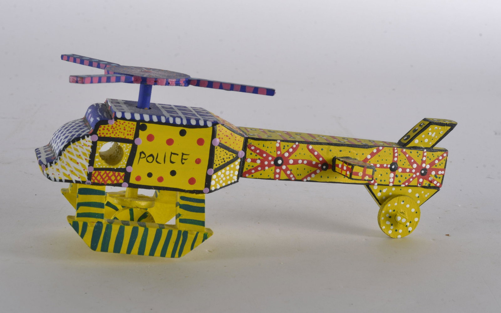 Oaxacan Folk Art Helicopter: MECHANICAL, WOOD, PAINTED, CARVED, POLICE HELICOPTER 9" L X 3..5"