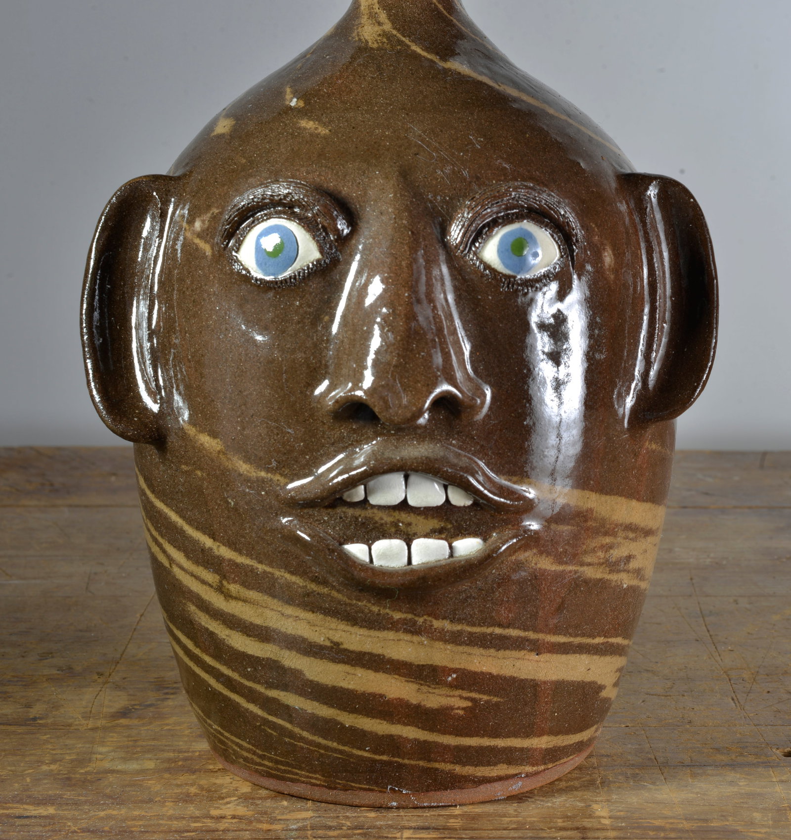 JOE REINHARDT DOUBLE HANDLED FACE JUG (1 of 4)