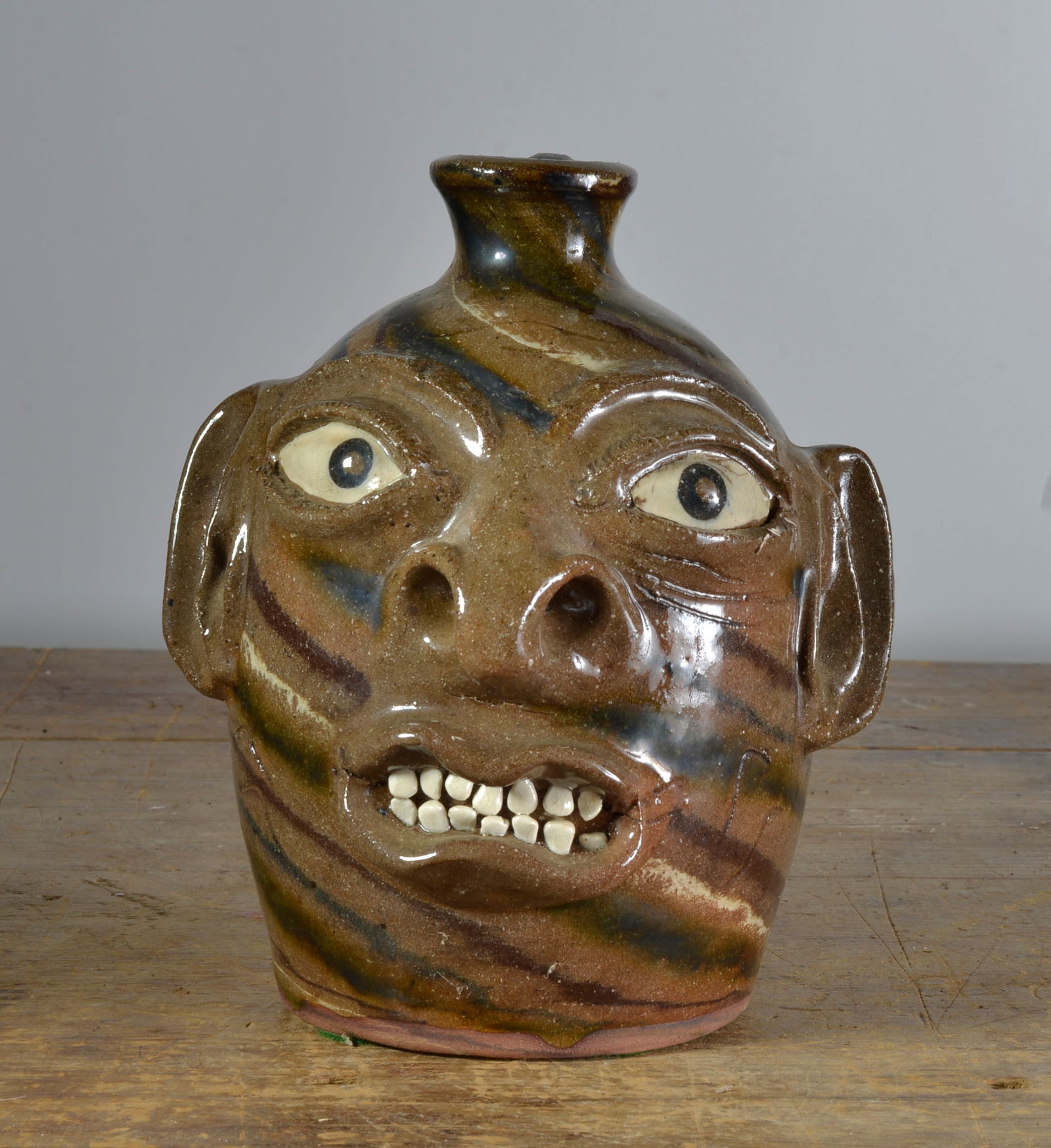 JOE REINHARDT SWIRL DOUBLE HANDLED FACE JUG (1 of 3)