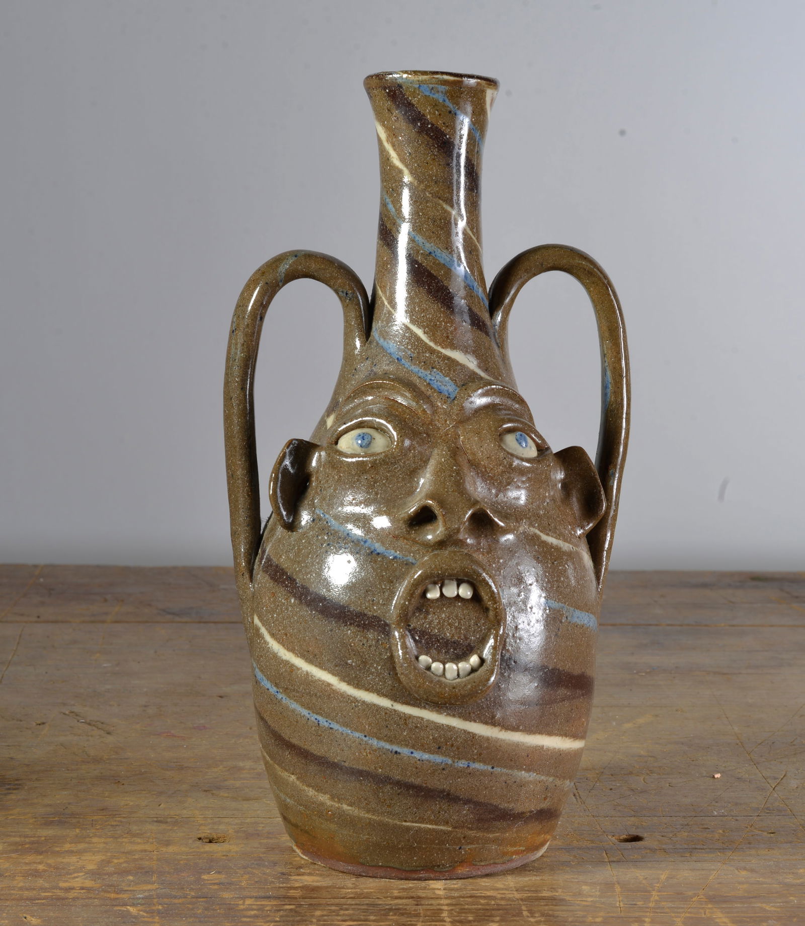 JOE REINHARDT DOUBLE HANDLED  SWIRL FACE VASE (1 of 3)