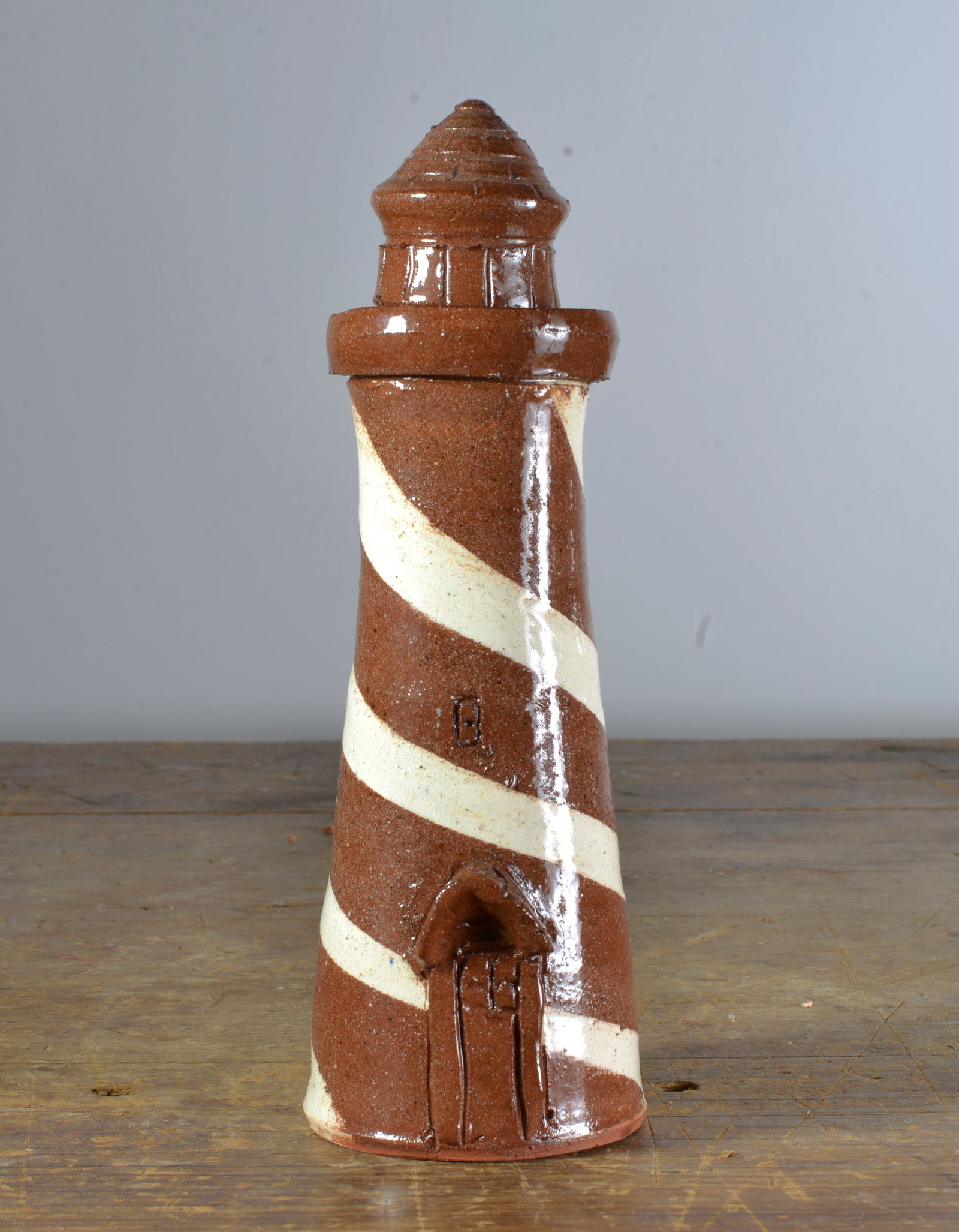 ALBERT HODGE FIRUGAL SWIRL LIGHT HOUSE: SWIRL FIGURAL LIGHT HOUSE, SIGNED ON BOTTOM, 10"H