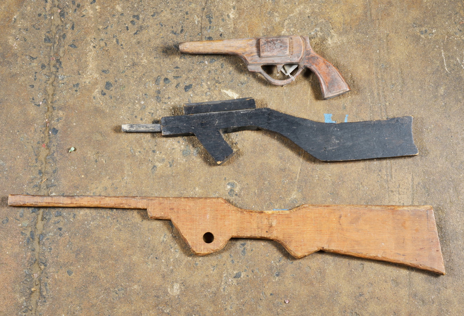 Folk Art Guns set of 3: wood and paint. Longest is 29"