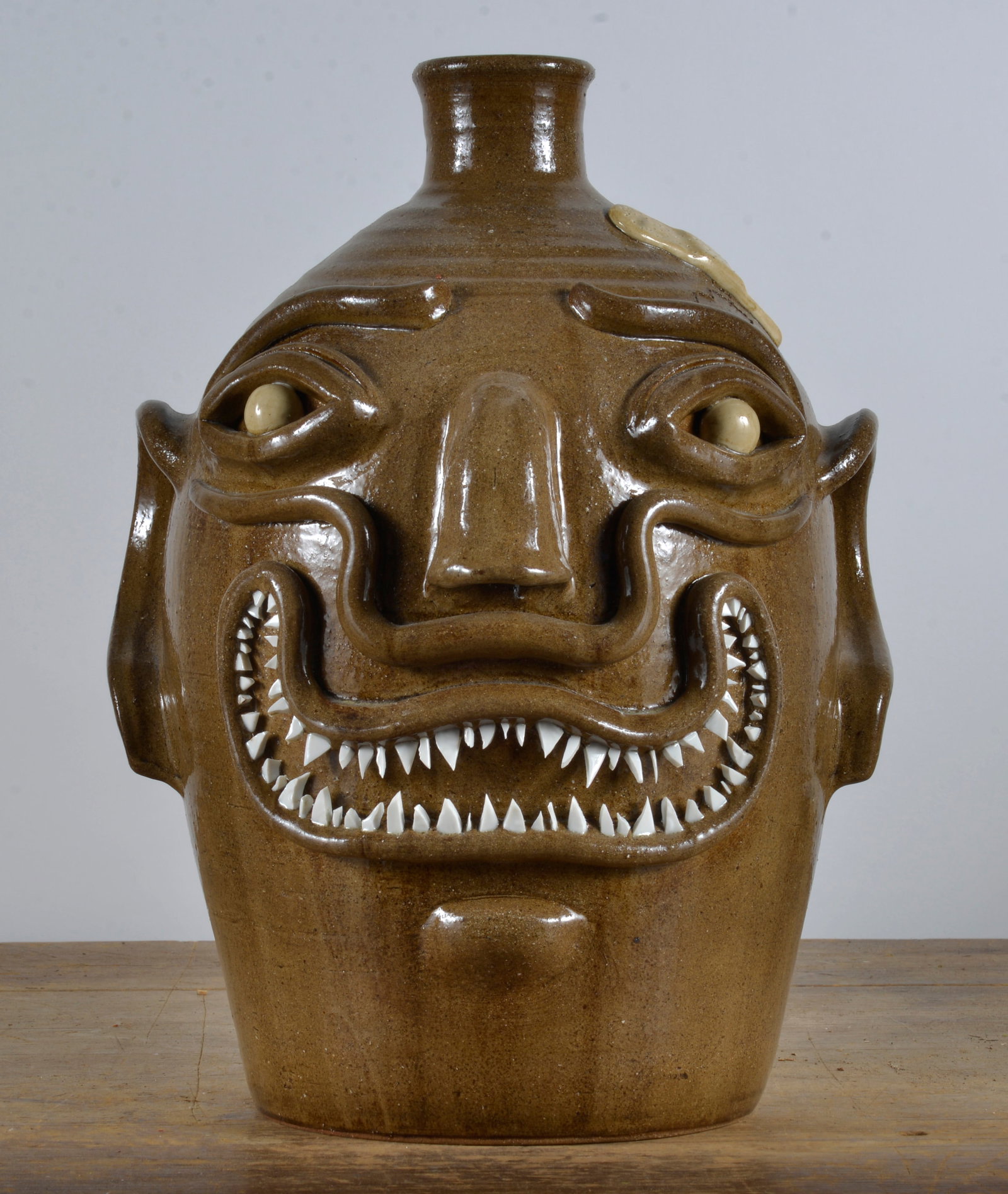 Michale Gates Face Jug: 16x12x12 Michael Gates large face jug with superior broken china teeth. This is a folky face jug to be considered one of the best! Michael Gates is a direct descendant of the Reinhardt Bros. pottery t