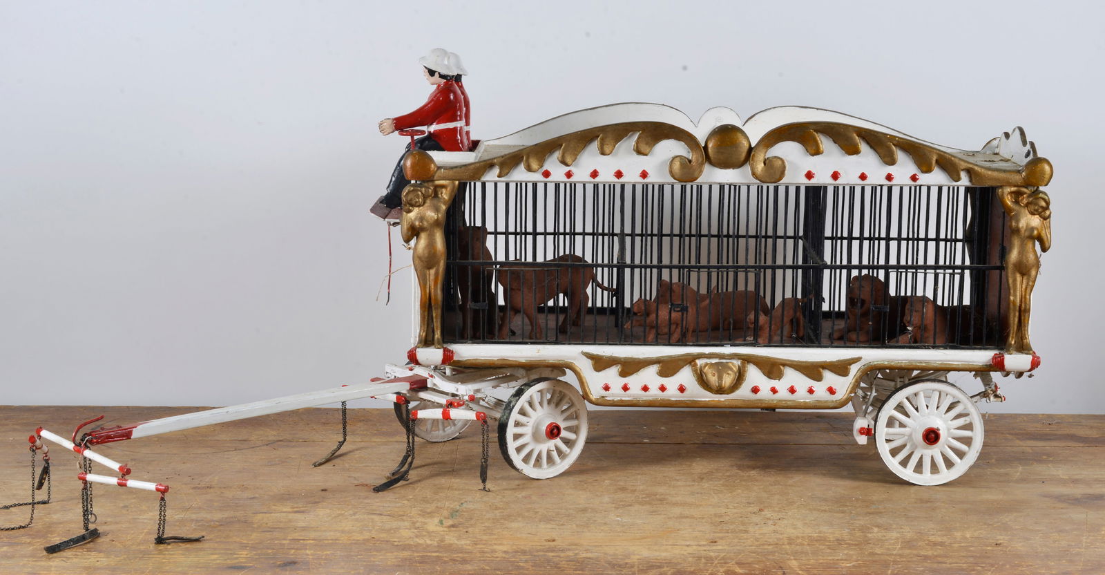 Folk Art Carved Circus Wagon: 29x14x10 take note of the nude carved women on the corners, animals inside are carved. A great piece of folk art.