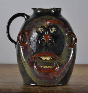 Roger Corn Double Face Jug Pitcher: very rare rare double face jug by Roger Corn… flee bite nick to the rim. 11"H