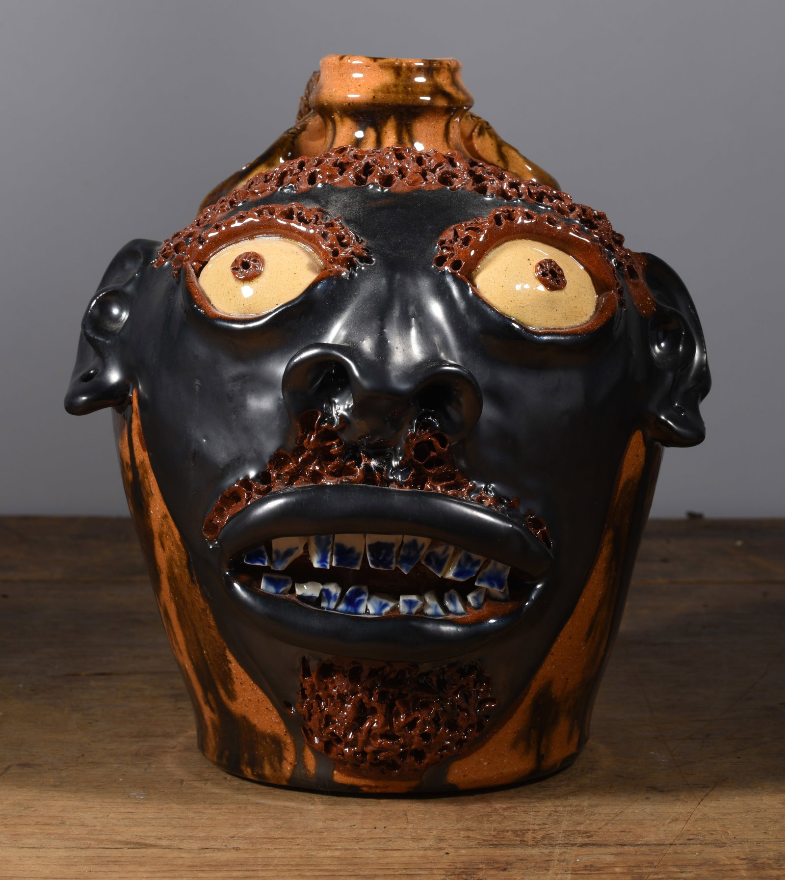 Billy Ray Hussey Face Jug: rare early face jug by Billy Ray Hussey. Snake handle. Multi glaze, unique china plate teeth with decoration. a very desirable and hard to find example of an early face jug by Billy. 11"