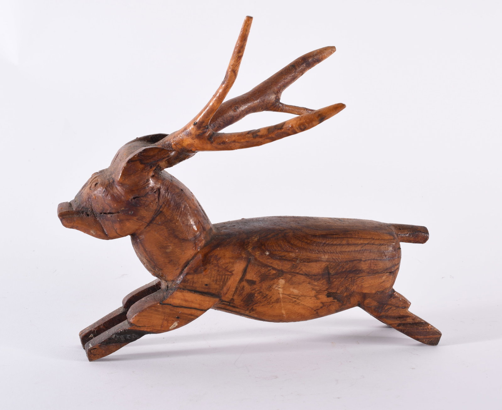 Carved Wooden Deer: 9"L X 8.5"H - carved wood and stain. From the collection of Larry Hackley
