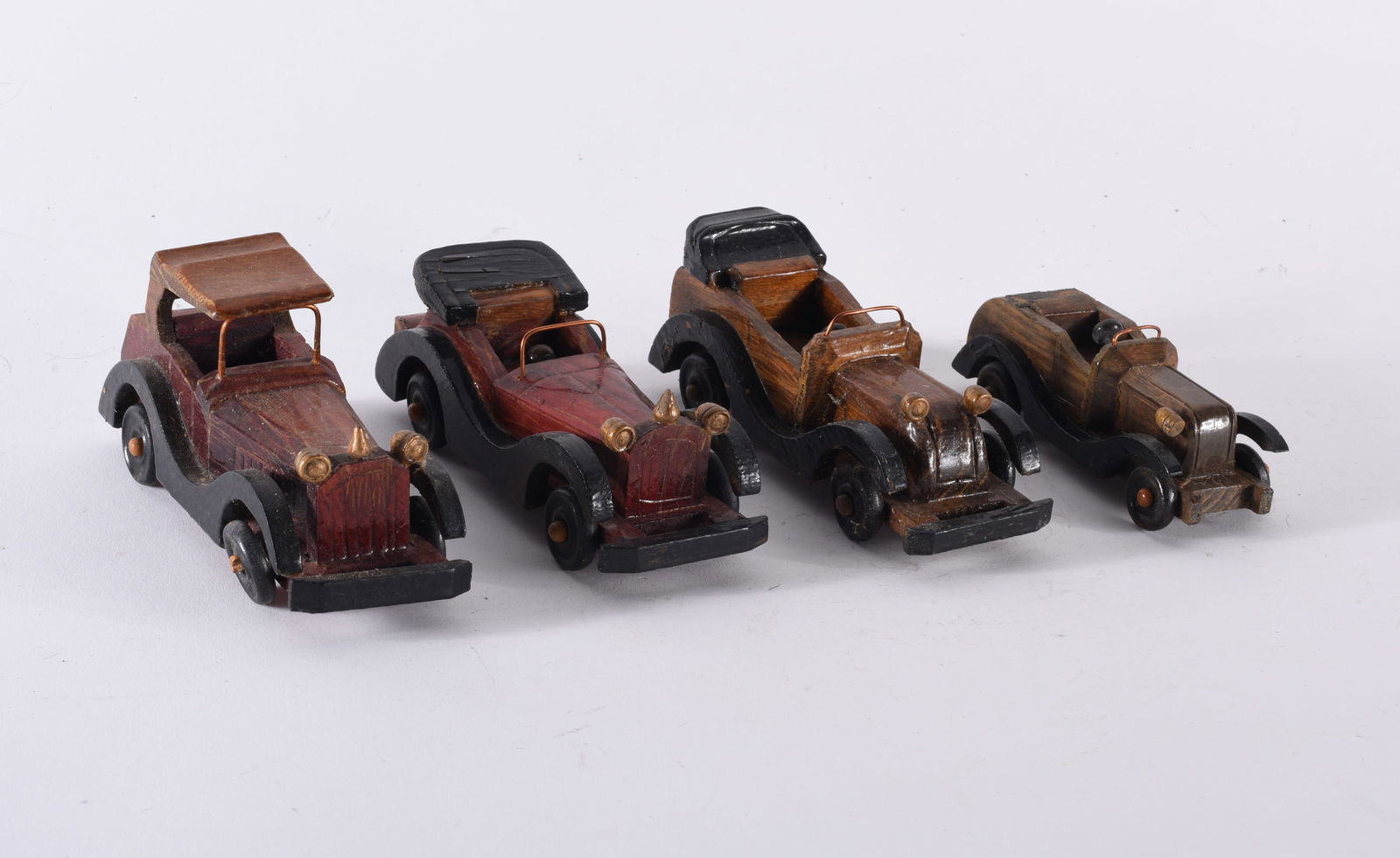 Carved Wooden Cars: LONGEST IS 6" - carved wood and stain with other material. From the collection of Larry Hackley