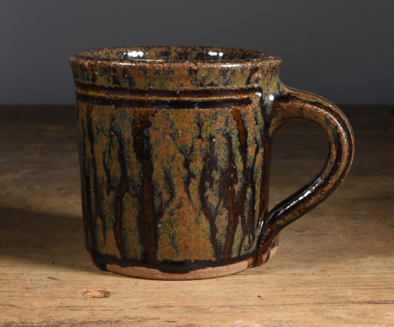 Kim Elllington Mug: pottery mug, alkaline glaze with runs, signed on bottom 3.5"H