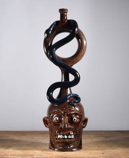 Marvin Bailey Face Jug Ring jug Snake: 22.5" Face Jug with a snake ring jug attached. A fantastic piece of folk pottery. Rock teeth and clay eyes. Signed on bottom.