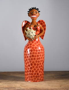 Marvin Bailey Orange Angel Figural: 19" folk pottery angel holding a miniature devil face jug. A colorful orange pocadot dress.
