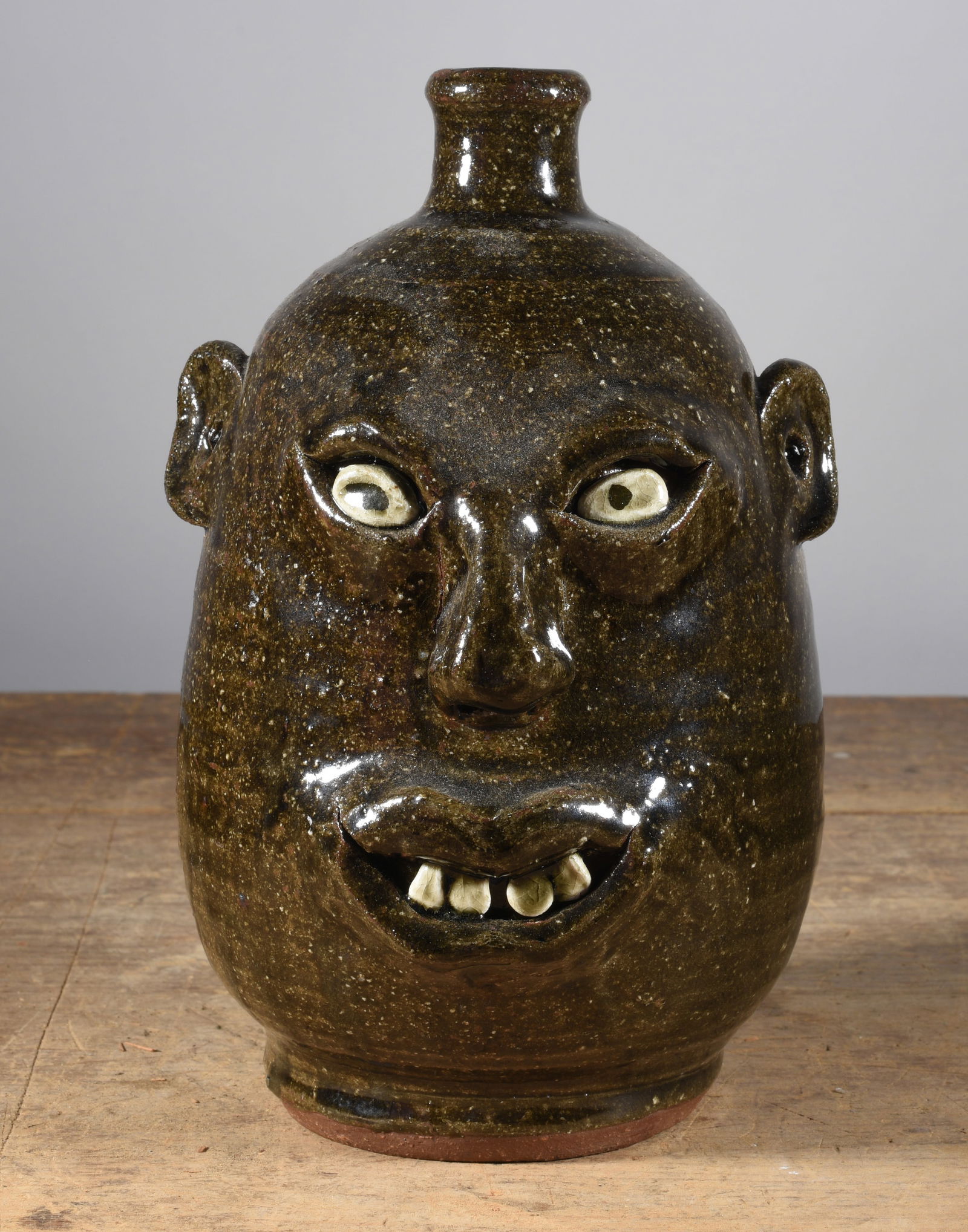 Anita Meaders Face Jug: 9" outstanding alkaline glaze face jug, clay eyes and clay teeth. Signed on bottom with an outstanding deep incised signature.