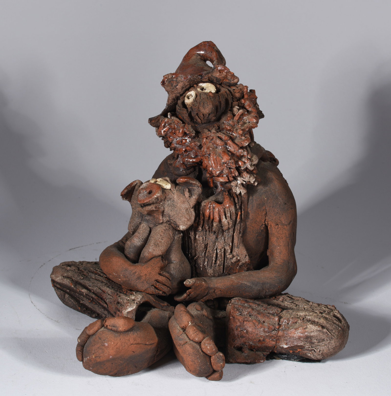 Pottery Figure Holding Pig: 6" unique pottery figure holding a pig